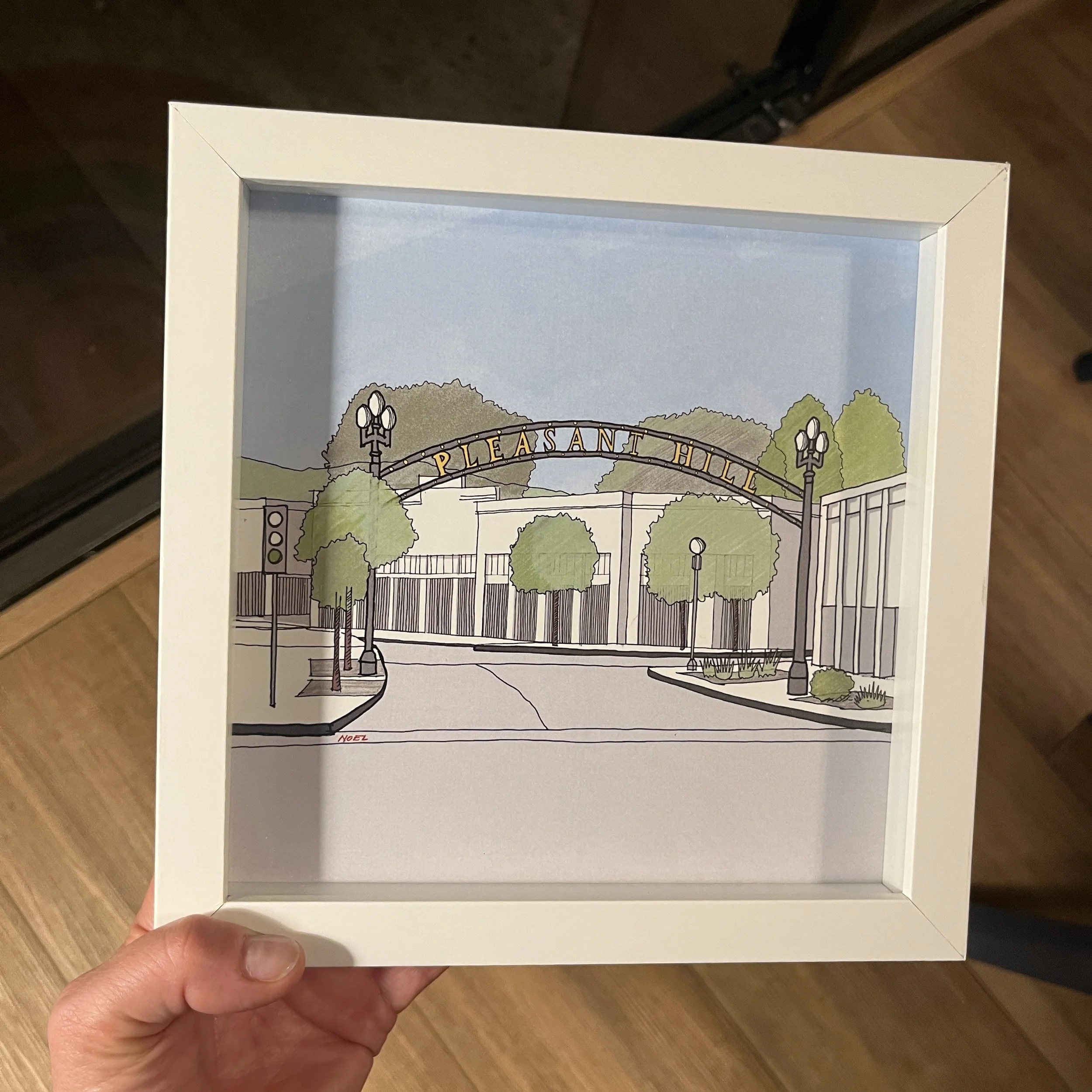 Framed Pleasant Hill Downtown city sign illustration displayed as modern home decor wall art.