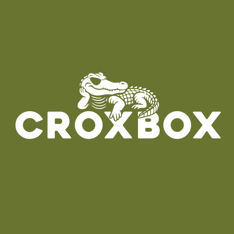 Green background with a white crocodile wearing an eye patch with its head resting on its hand, above the text 'CROXBOX', which is the name of a metal parcelbox designed for safe, easy and dry delivery of online products