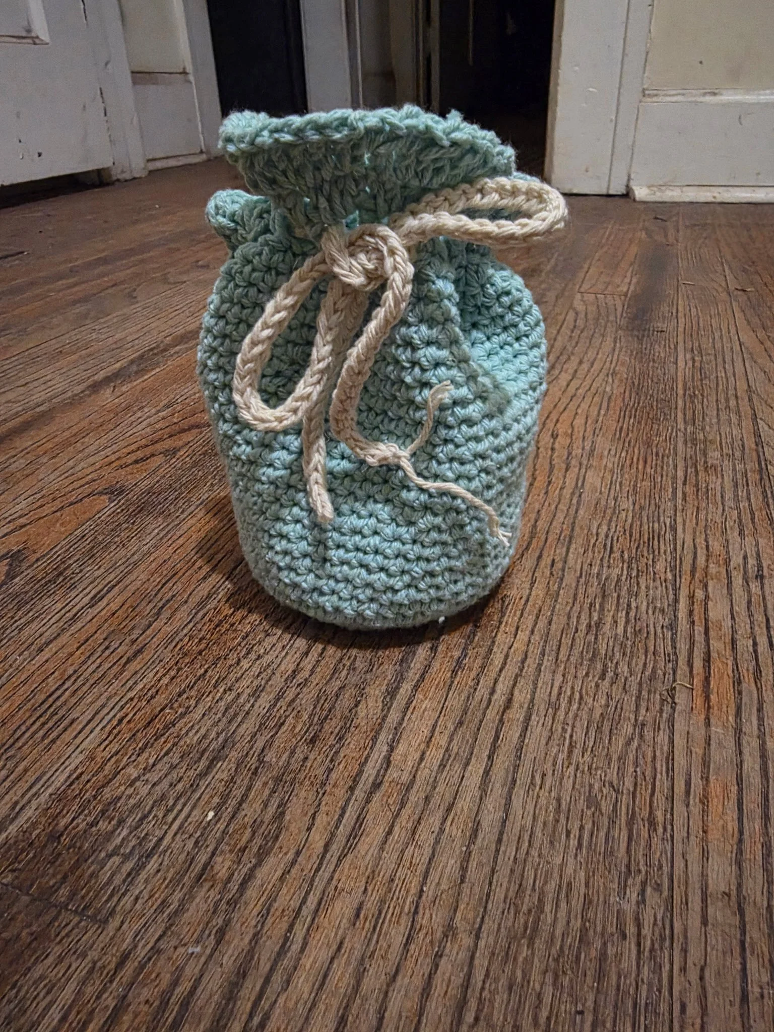 Handmade crochet drawstring bag in blue by Jasmyn Steele
