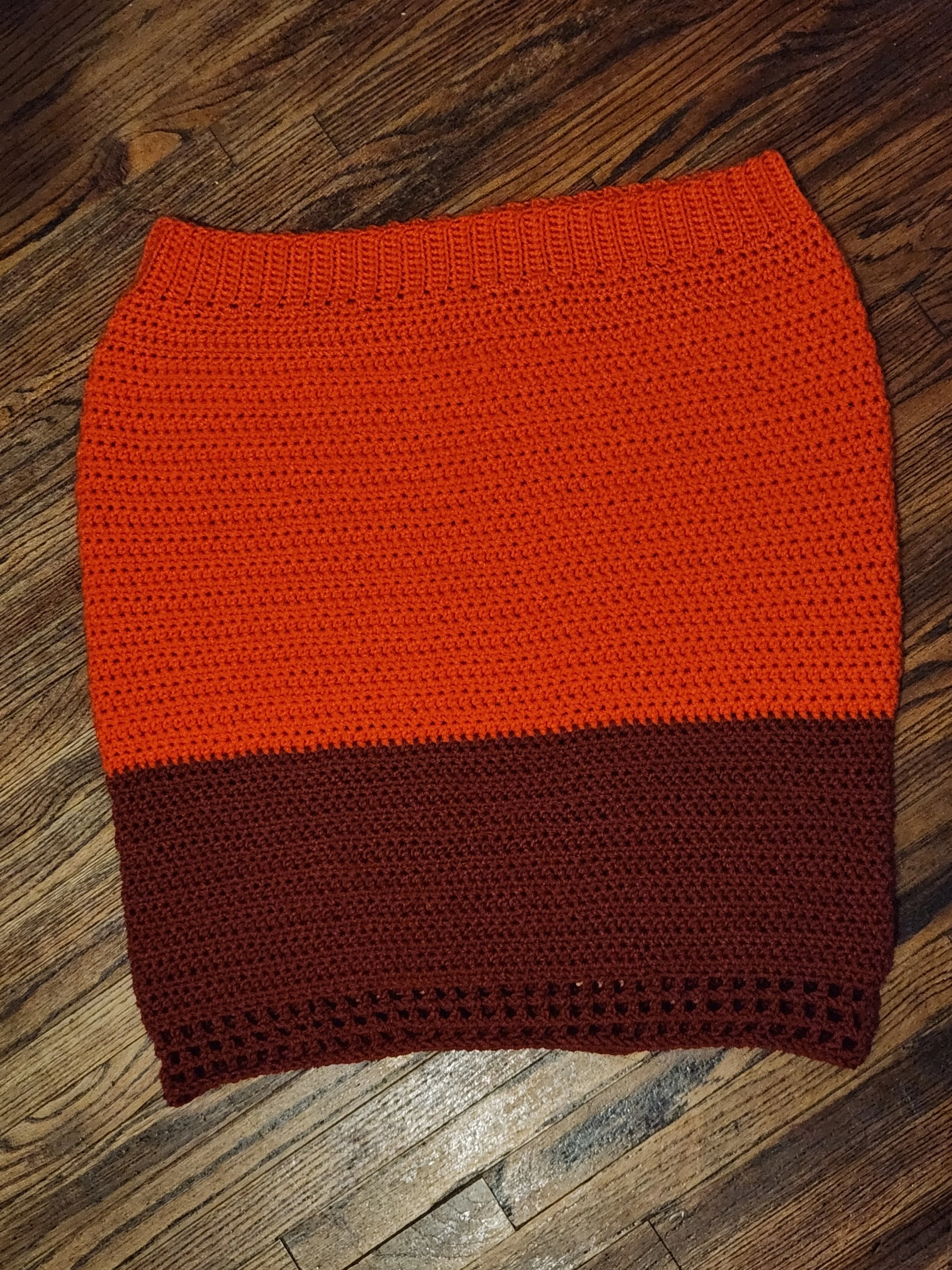 Handmade crochet fitted skirt in orange, back view