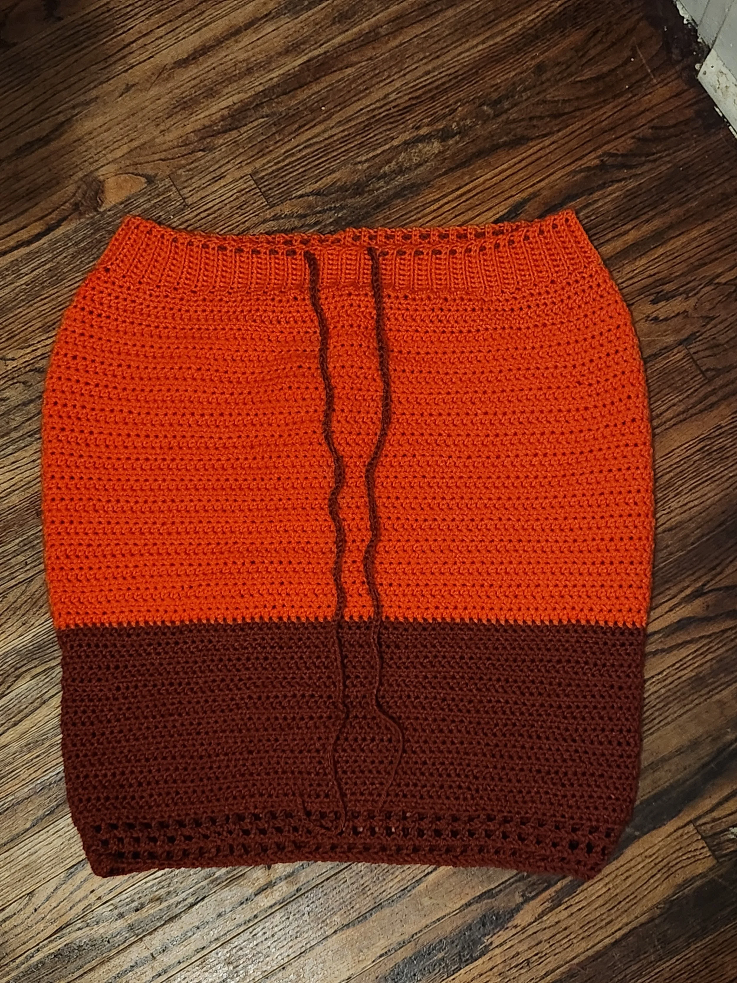 Handmade crochet fitted skirt in orange, front view