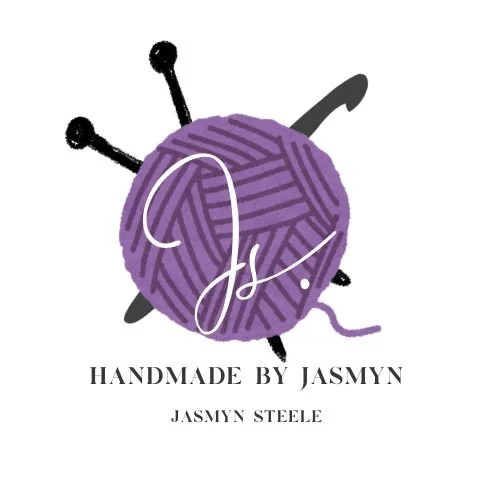 Logo with a purple ball of yarn with black and white knitting needles, featuring a white stylized signature and text that reads 'Handmade by Jasmyn' and 'Jasmyn Steele'.