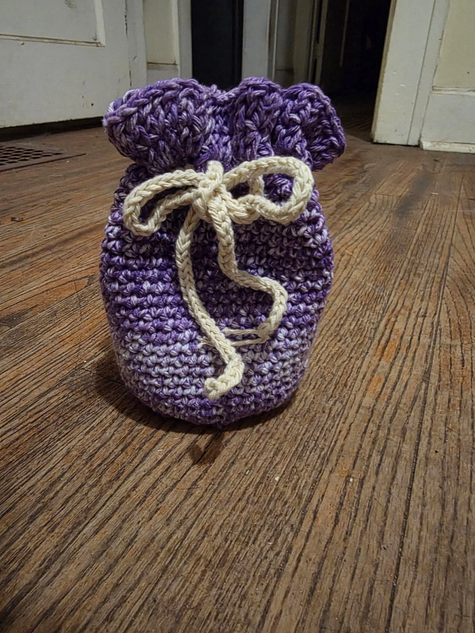 Handmade crochet drawstring bag in purple by Jasmyn Steele