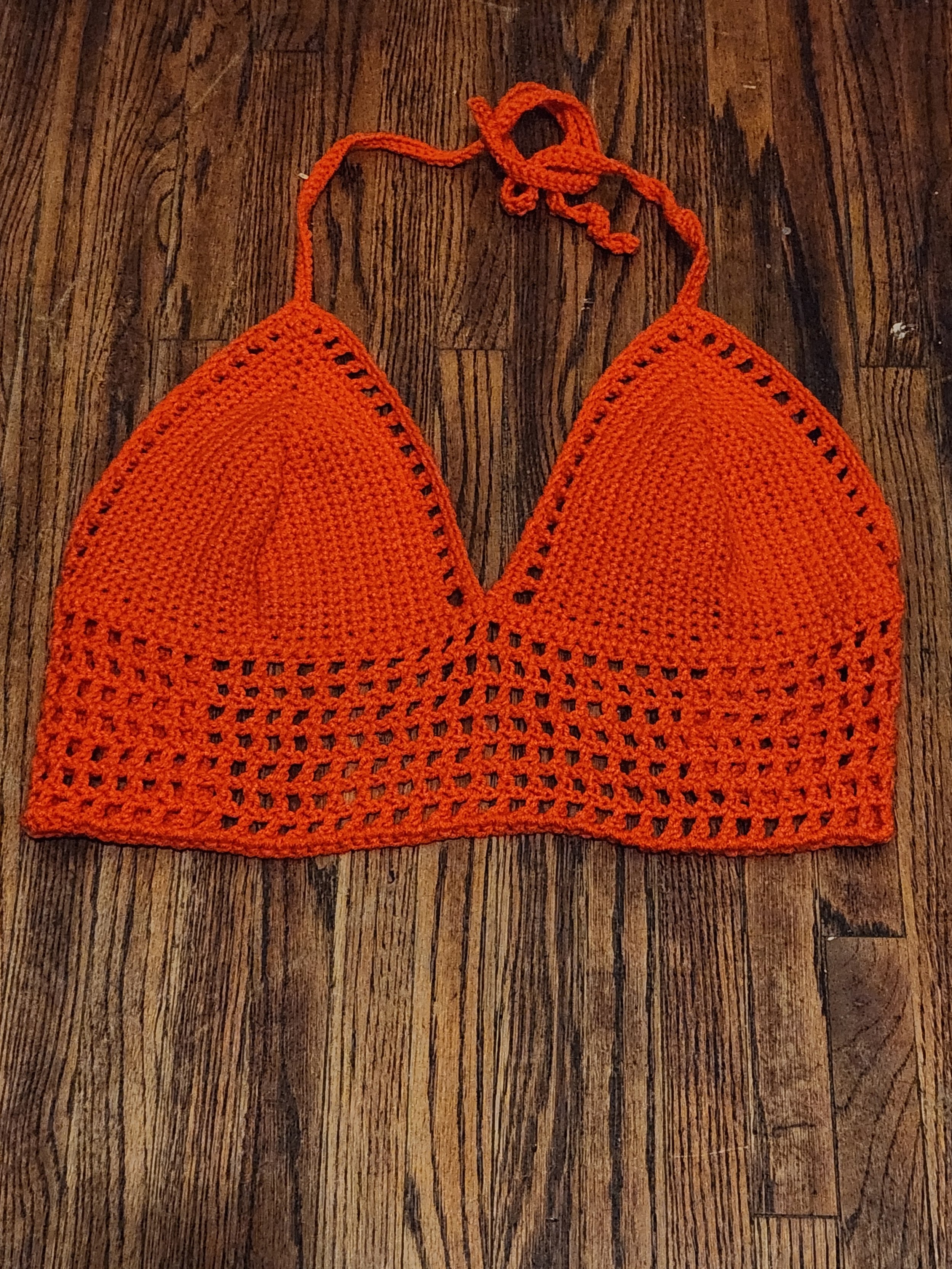 Handmade crochet mesh top bralette front view, unlaced, in orange, size large