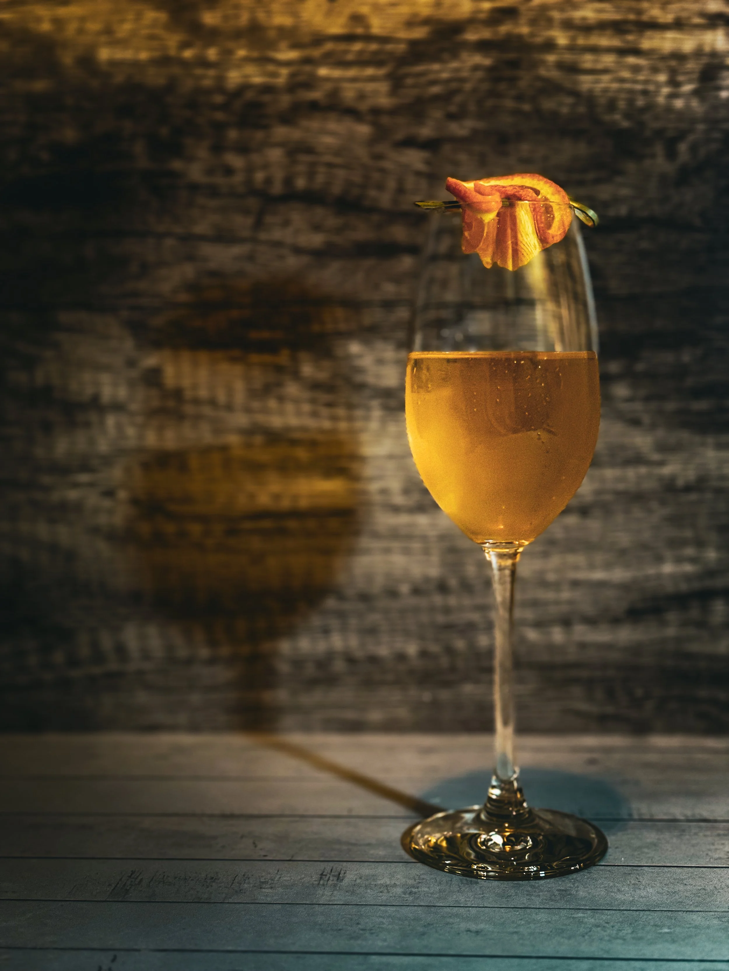 Spiced Blood Orange Spritz
Crémant, blood orange, cinnamon. Bold color, bold flavor, fall’s fiery finish.