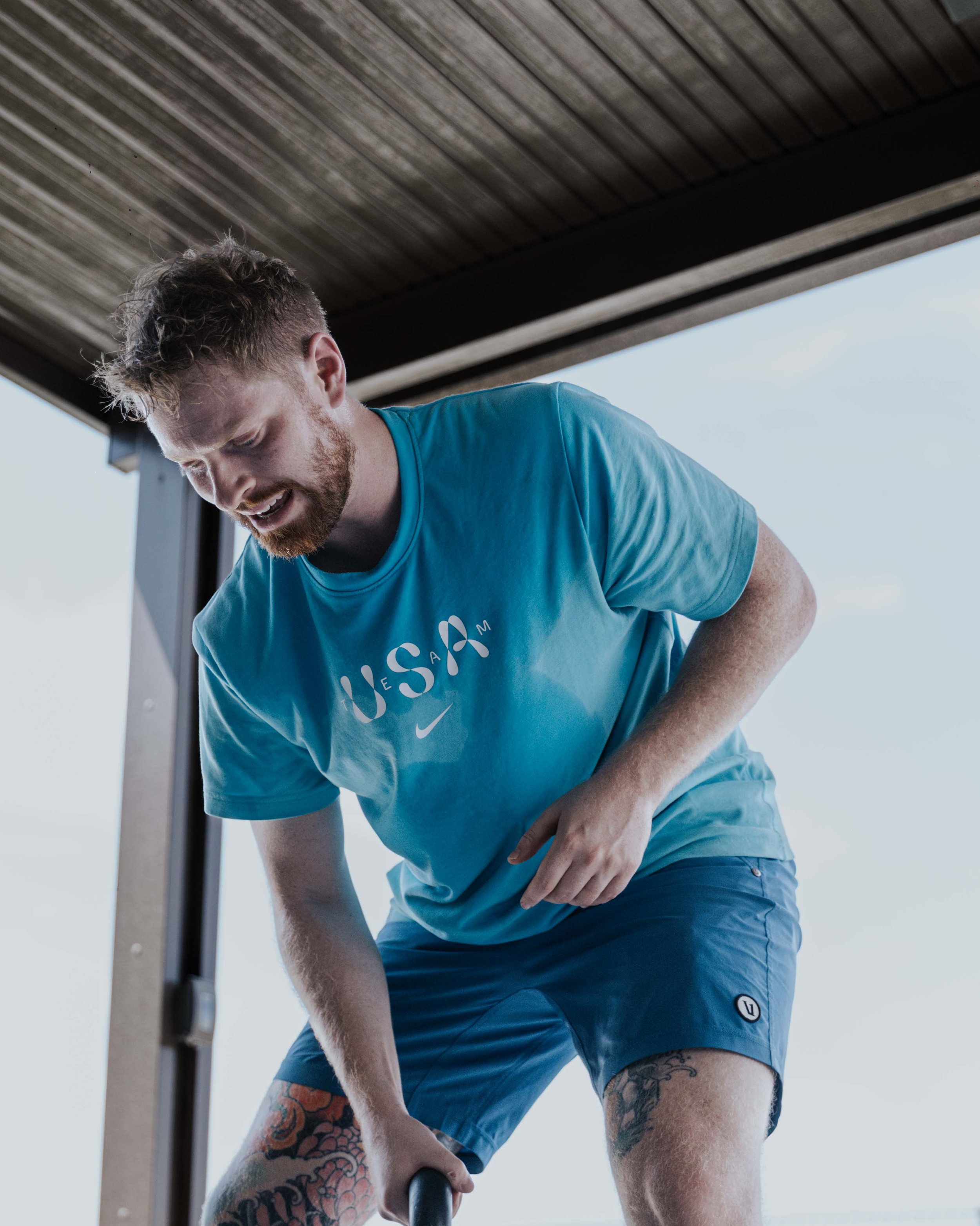 Taylor training with a kettlebell during an outdoor workout.