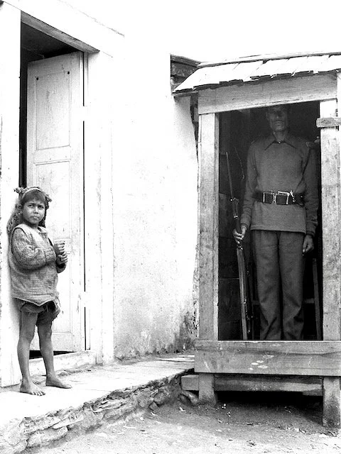 Sentry outside bank in Salleri