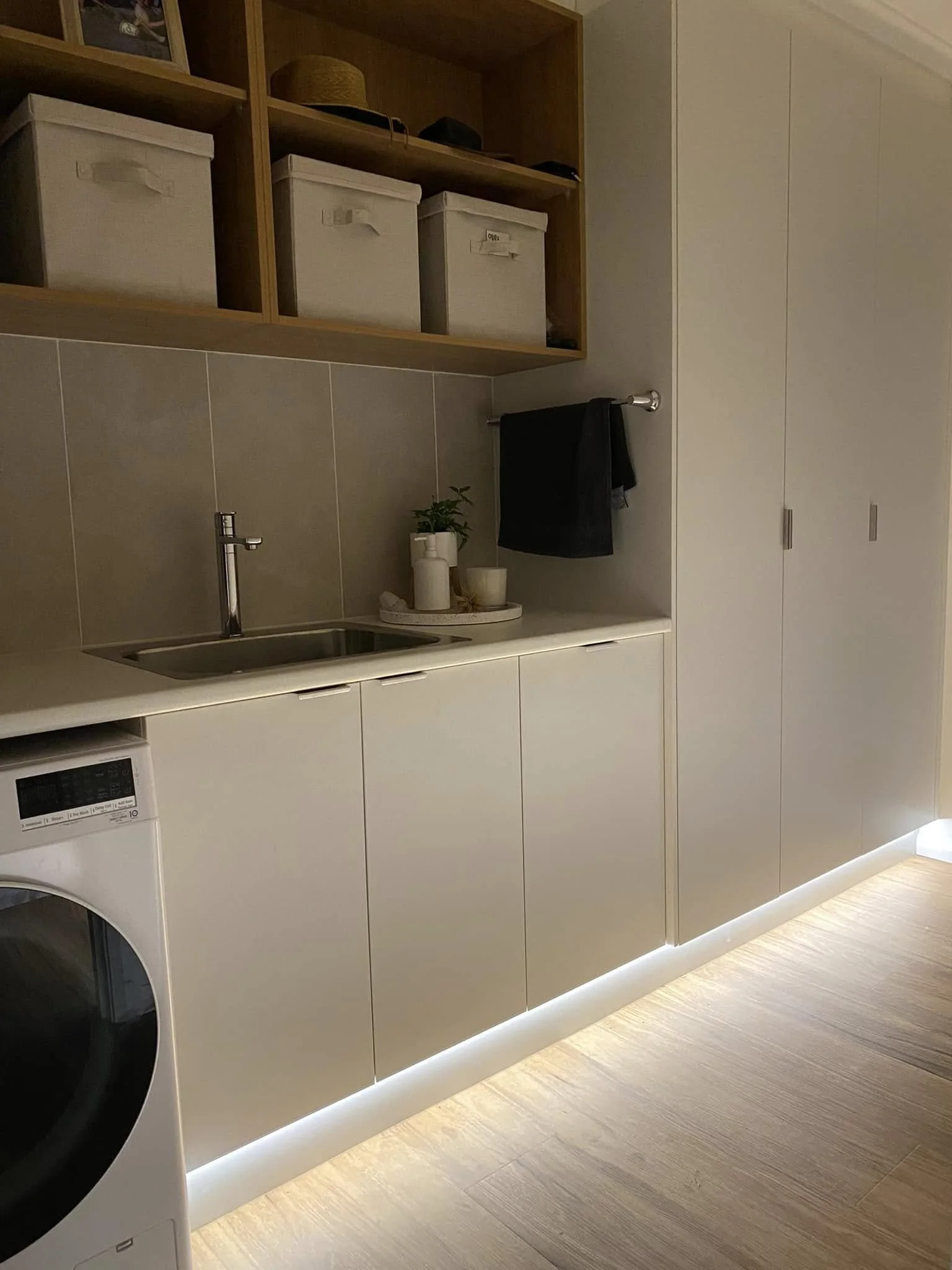Lighting design in a white laundry room