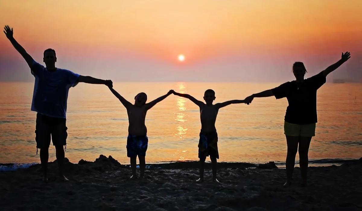 family having fun on the beach