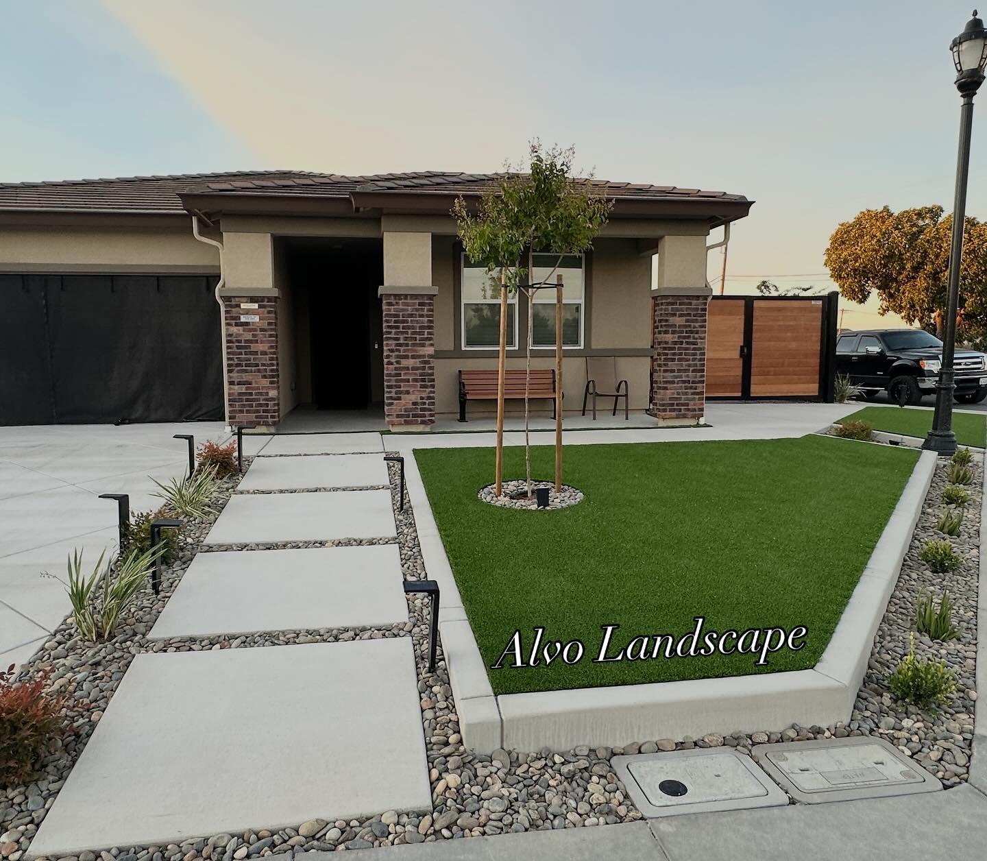 Chat ! ! ! Here we transformed the Corner front yard to be functional but also meet city code regulations.
>7Ft Fence for more privacy 
>Artificial turf for low maintenance 
> Concrete drive way extension + walk ways to tie the whole lot to 