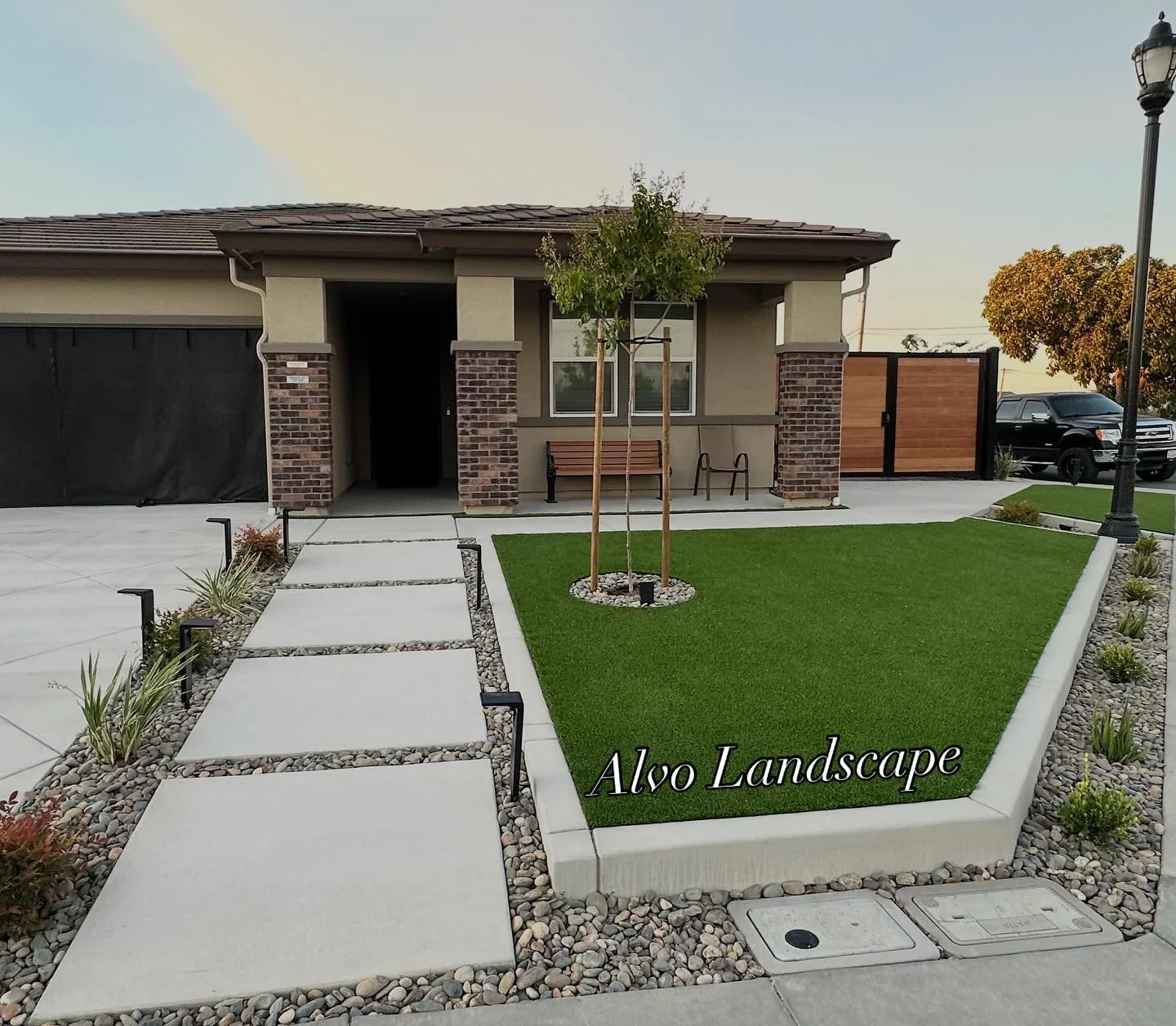 Chat ! ! ! Here we transformed the Corner front yard to be functional but also meet city code regulations.
>7Ft Fence for more privacy 
>Artificial turf for low maintenance 
> Concrete drive way extension + walk ways to tie the whole lot to 