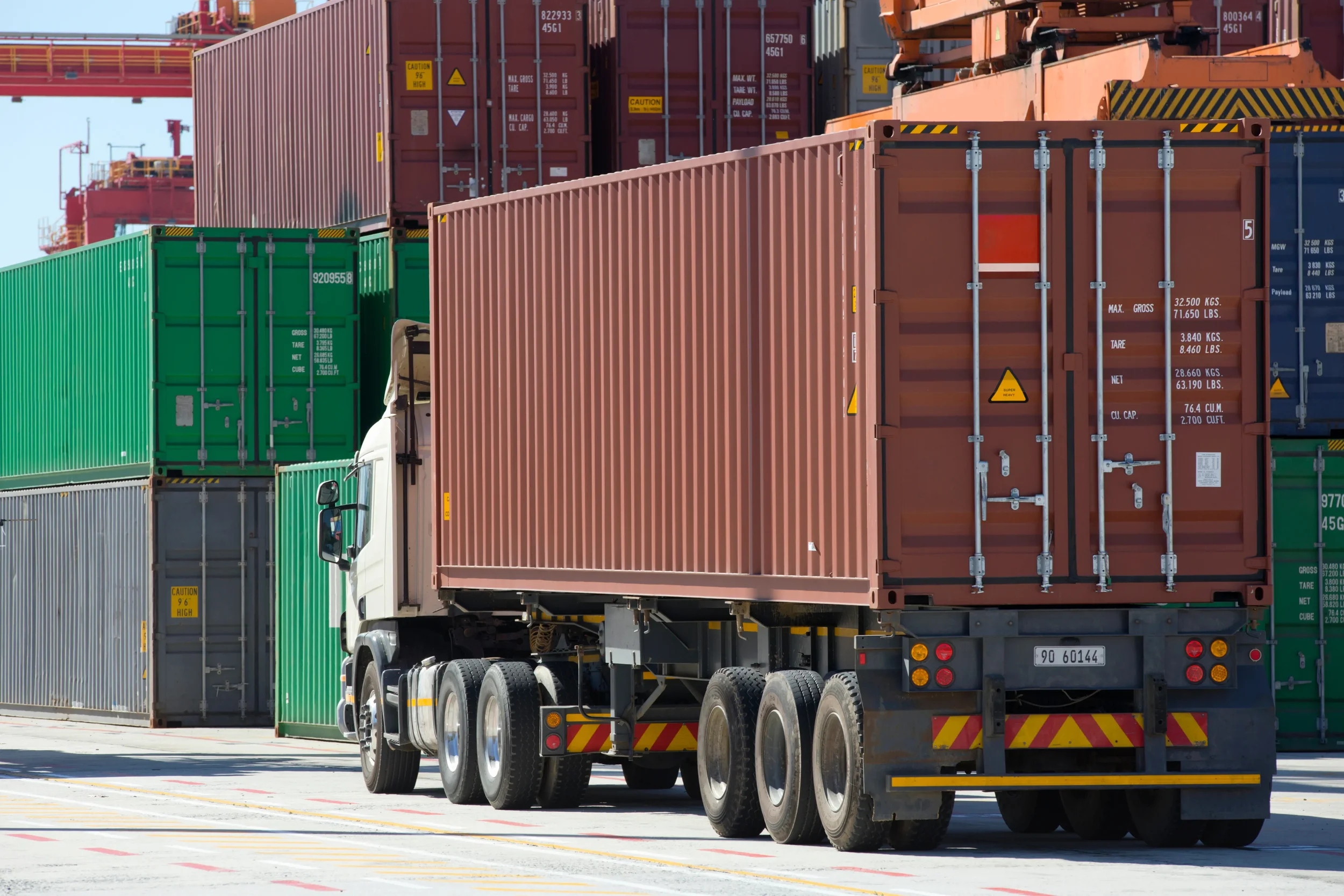 General view of the back of a trailer showing more containers to begin the supply chain.