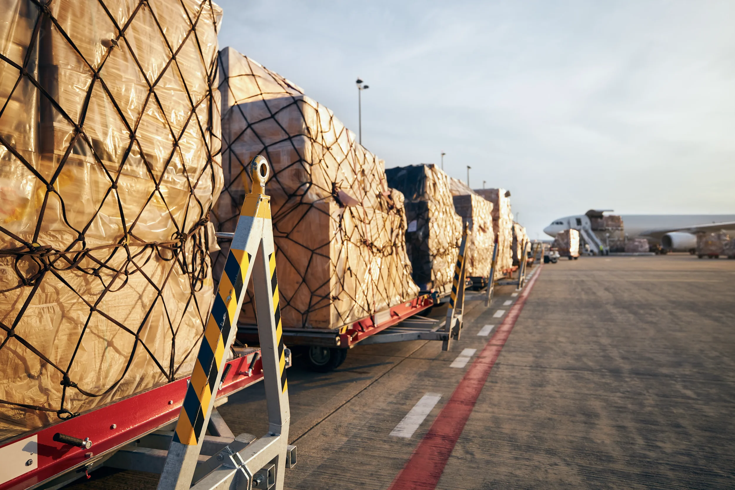 View of a row of various cargoes to be transported by airplane.