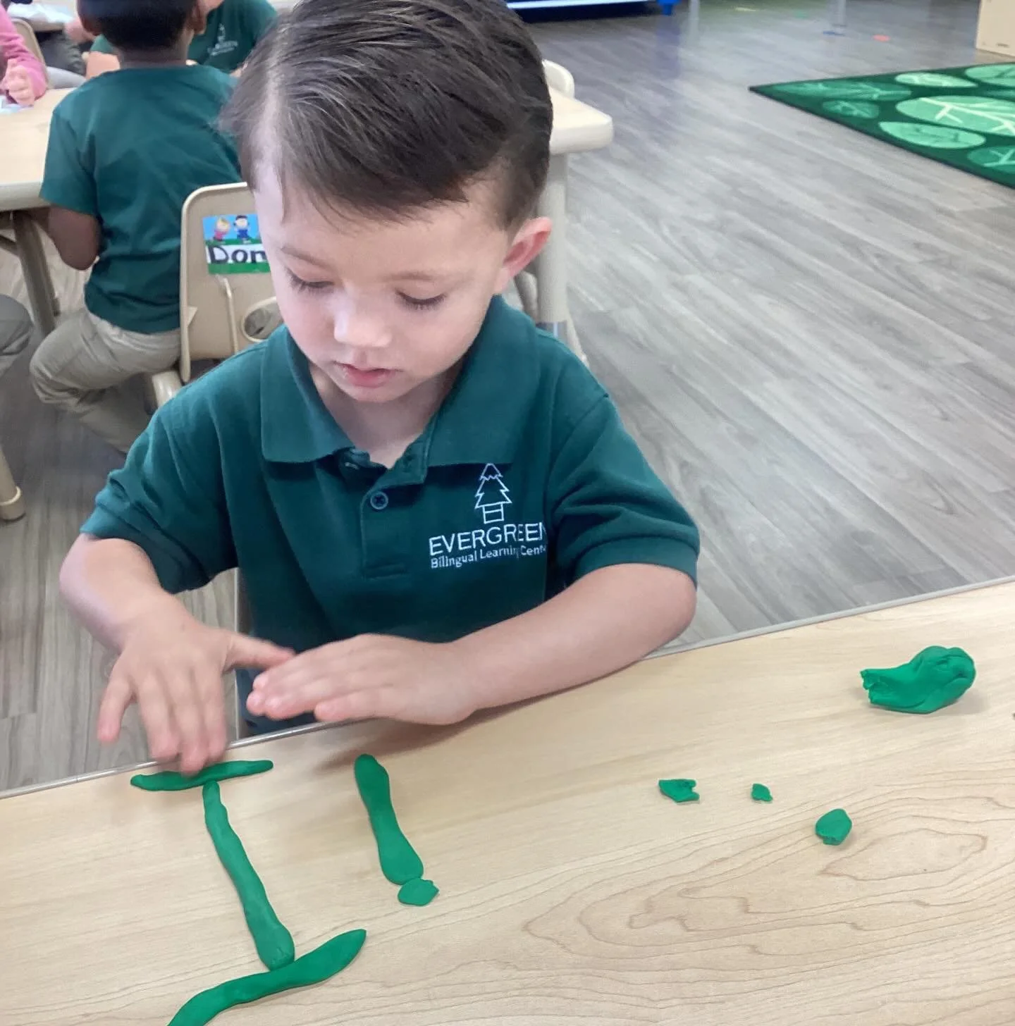 At Evergreen, fine motor development isn&rsquo;t just one activity&mdash;it&rsquo;s woven throughout our entire day! ✋✨

Today, one of our little learners is strengthening those tiny muscles by creating the letter of the week using playdough. As they