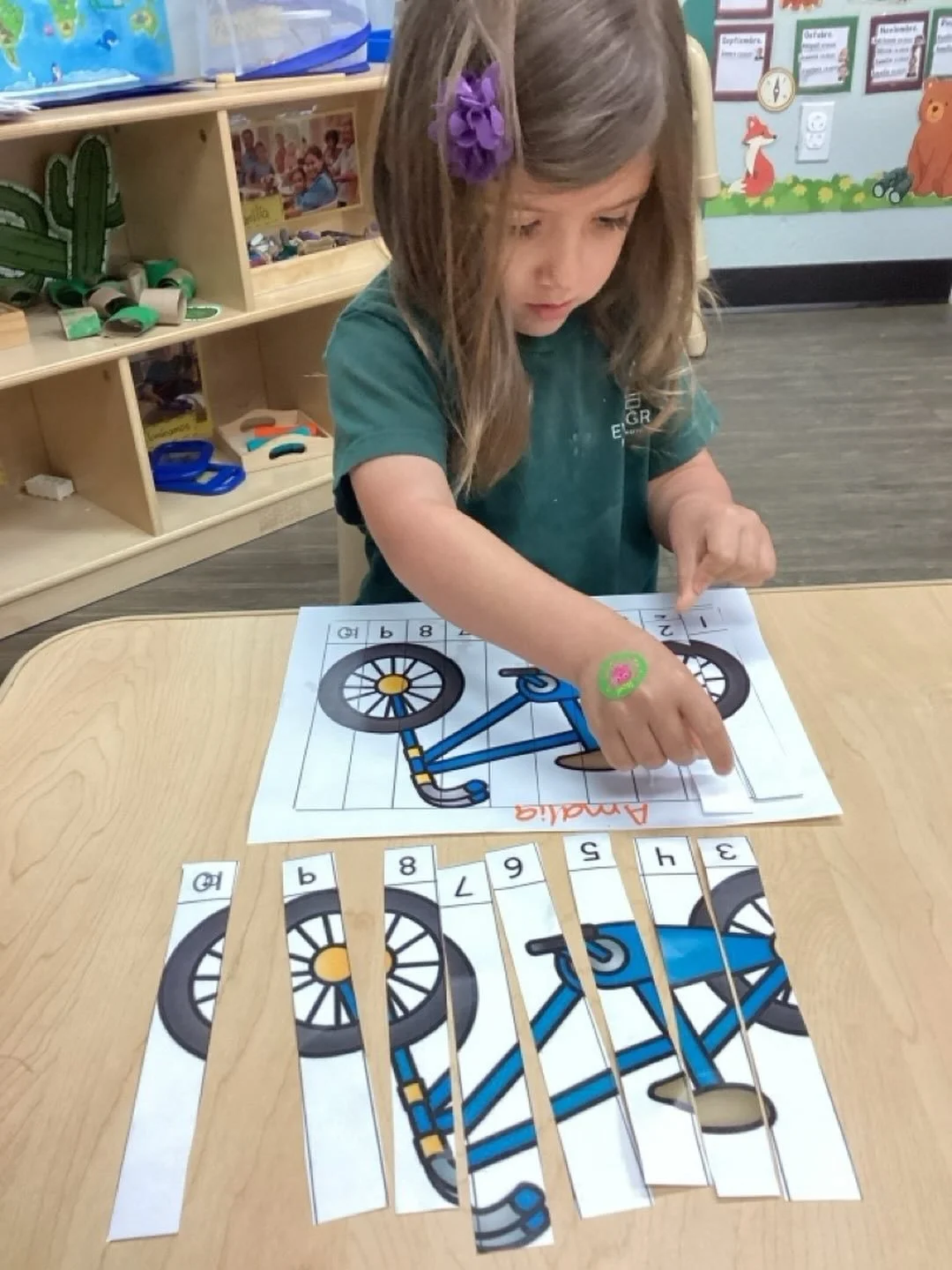 Today, Amalia worked on a fun bicycle puzzle activity! As she explored and pieced it together, she practiced number correspondence, helping strengthen her understanding of numbers and sequencing.

🧩 This hands-on experience also supported:
&bull; Nu