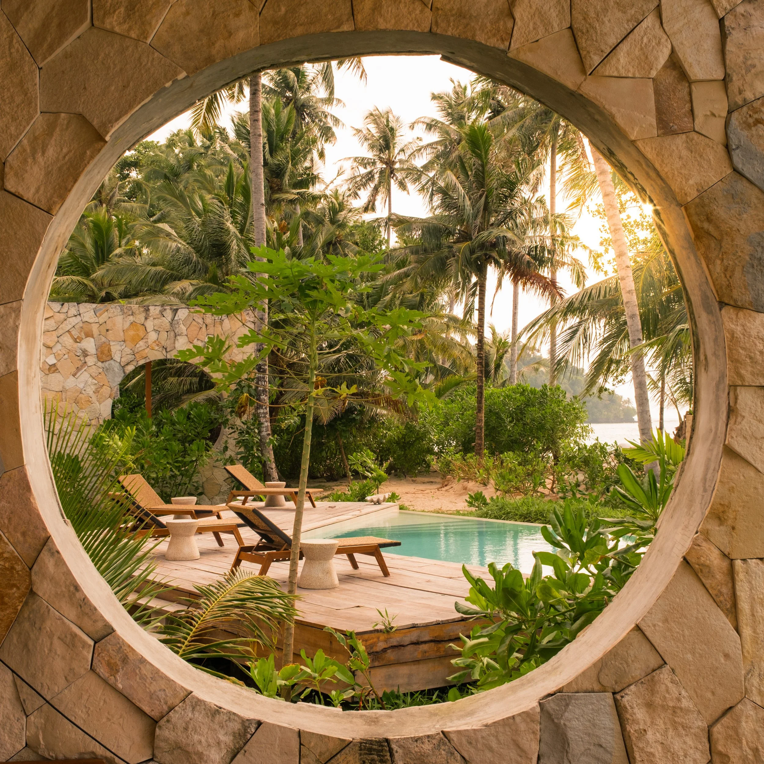 Architectural-photography-circular-window-pool-view.jpg