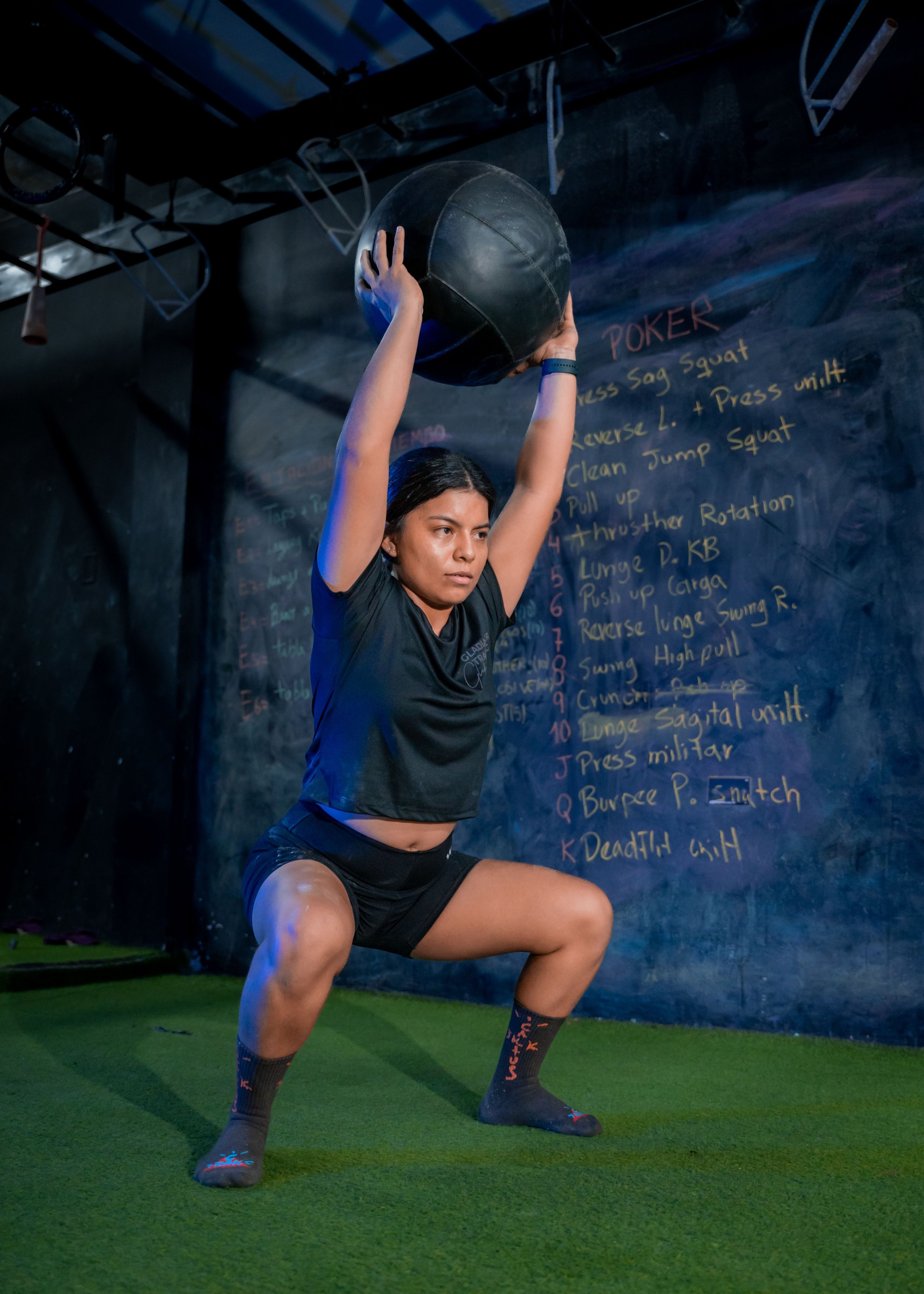 squatting with a medicine ball