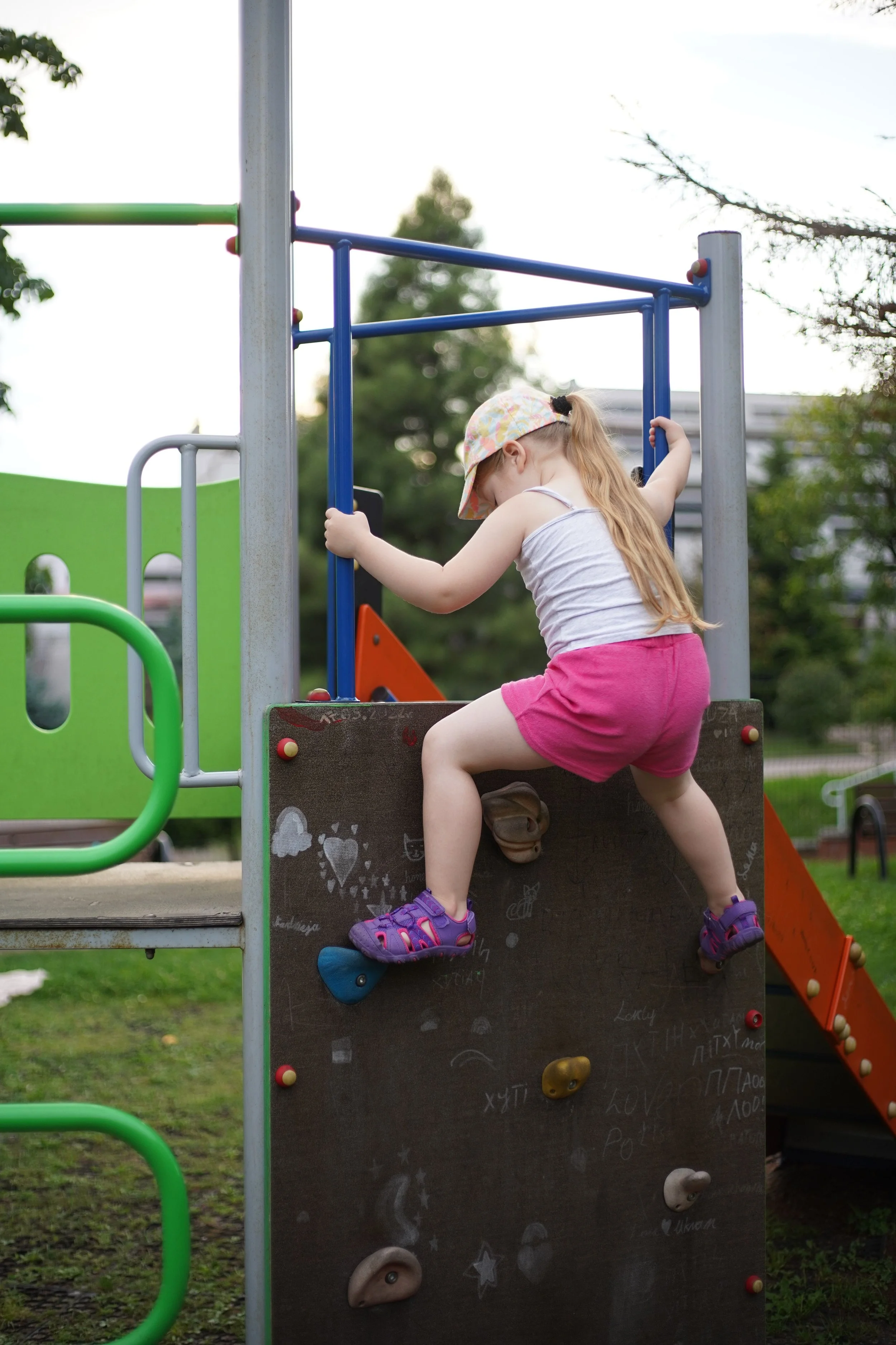 climbing a wall on a playground