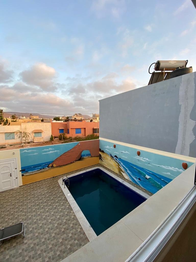 Surf villa Mirleft Morocco with private swimmingpool on rooftop with ocean view