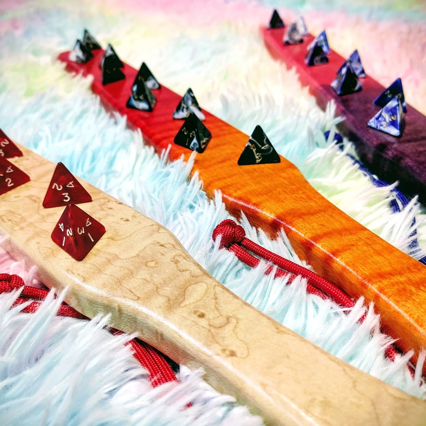 So you know how the venn diagram of kinky, poly, and D&amp;D tends to overlap quite a lot...

These have been under wraps for a while, testing them out and making sure they were as durable and safe as possible.

9 D4 dice mounted to a solid wood rule