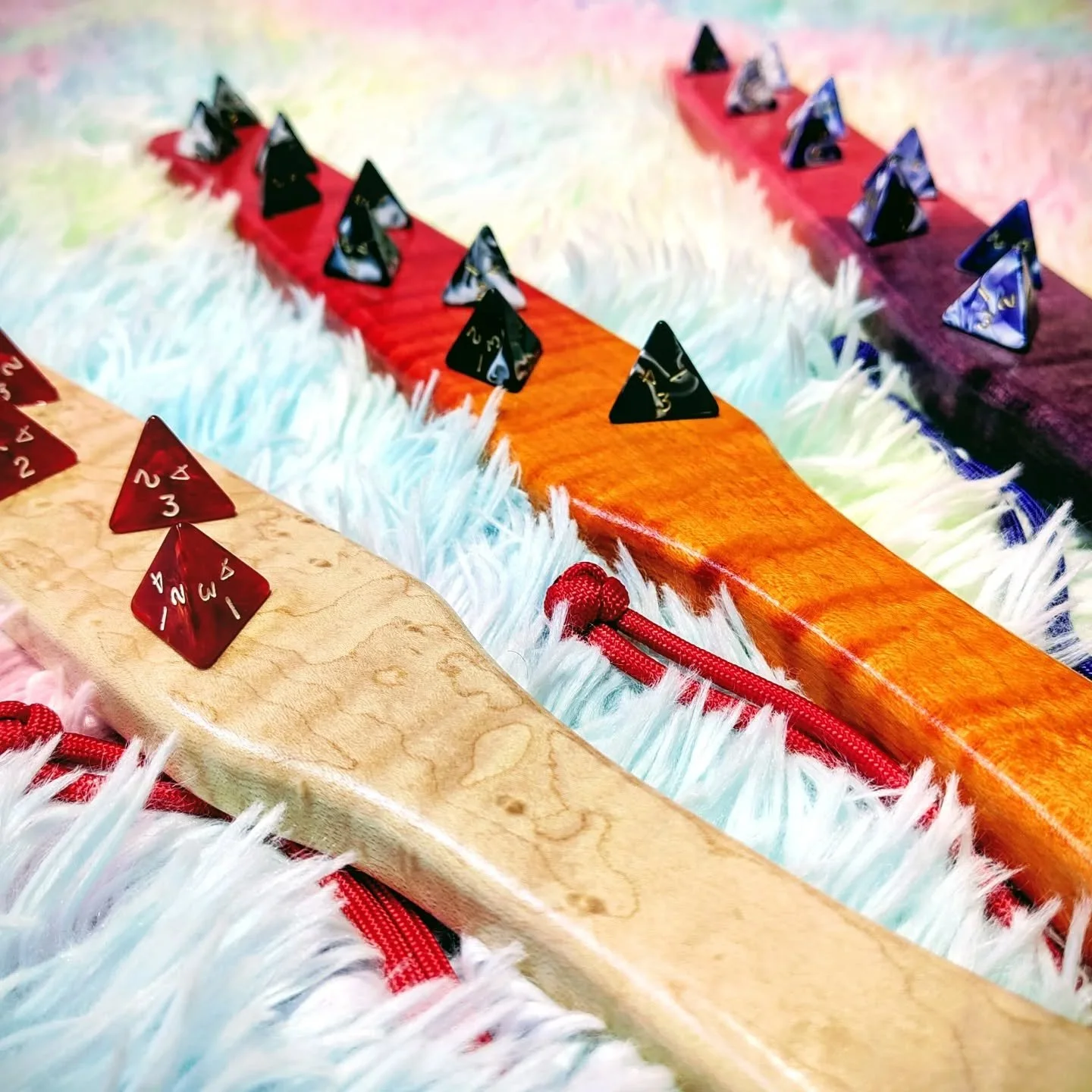 So you know how the venn diagram of kinky, poly, and D&amp;D tends to overlap quite a lot...

These have been under wraps for a while, testing them out and making sure they were as durable and safe as possible.

9 D4 dice mounted to a solid wood rule