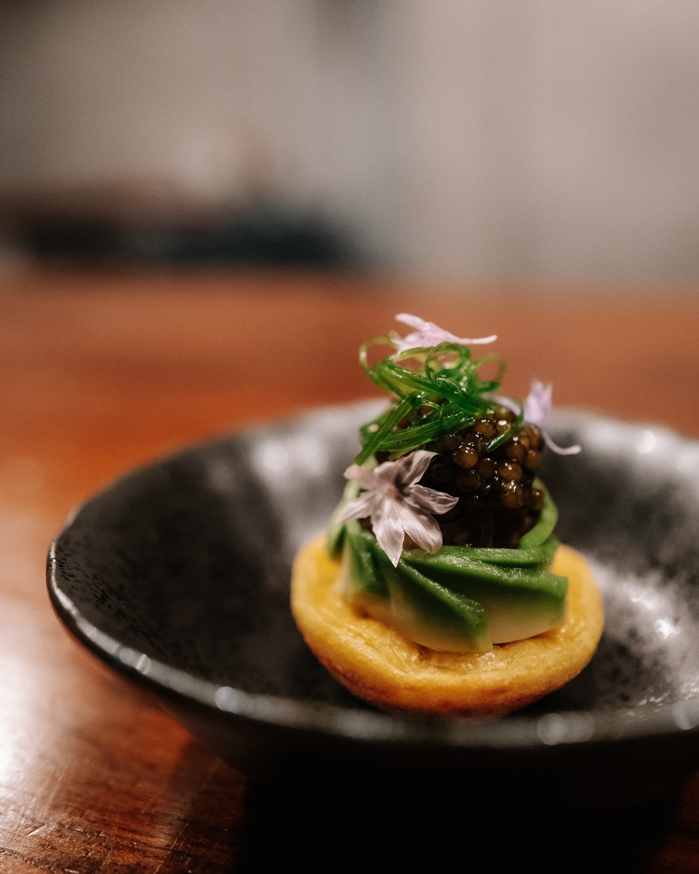 Kueh Cara

What we affectionately call our &ldquo;Asian blini&rdquo; &mdash; a fragrant base for bold flavour.

Ours is seasoned with turmeric and spring onion ends for warmth and gentle sweetness. Topped with creamy Indonesian avocado from Geylang S