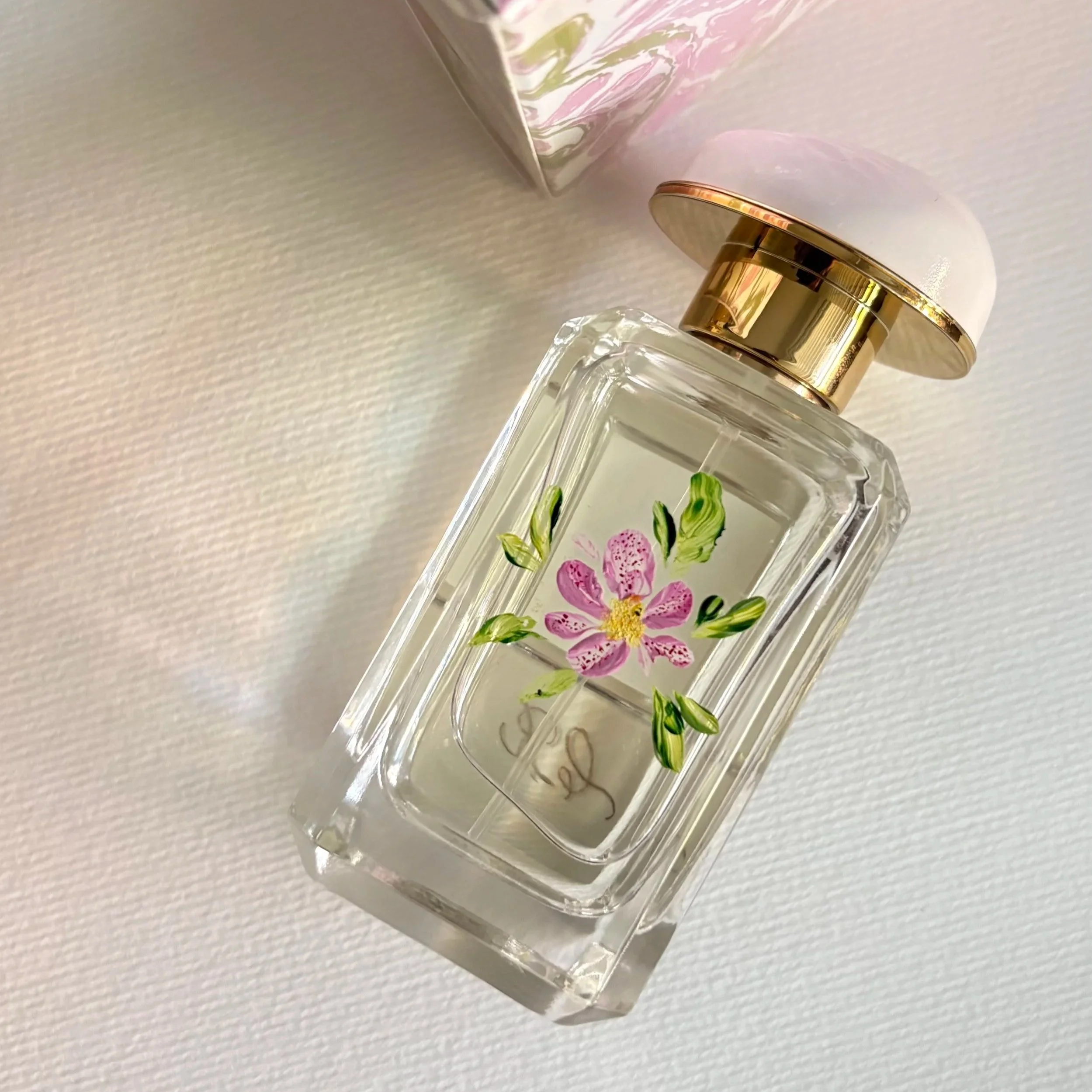 Bottle painting and personalised Aerin gift bottle, created for a bespoke gifting experience.