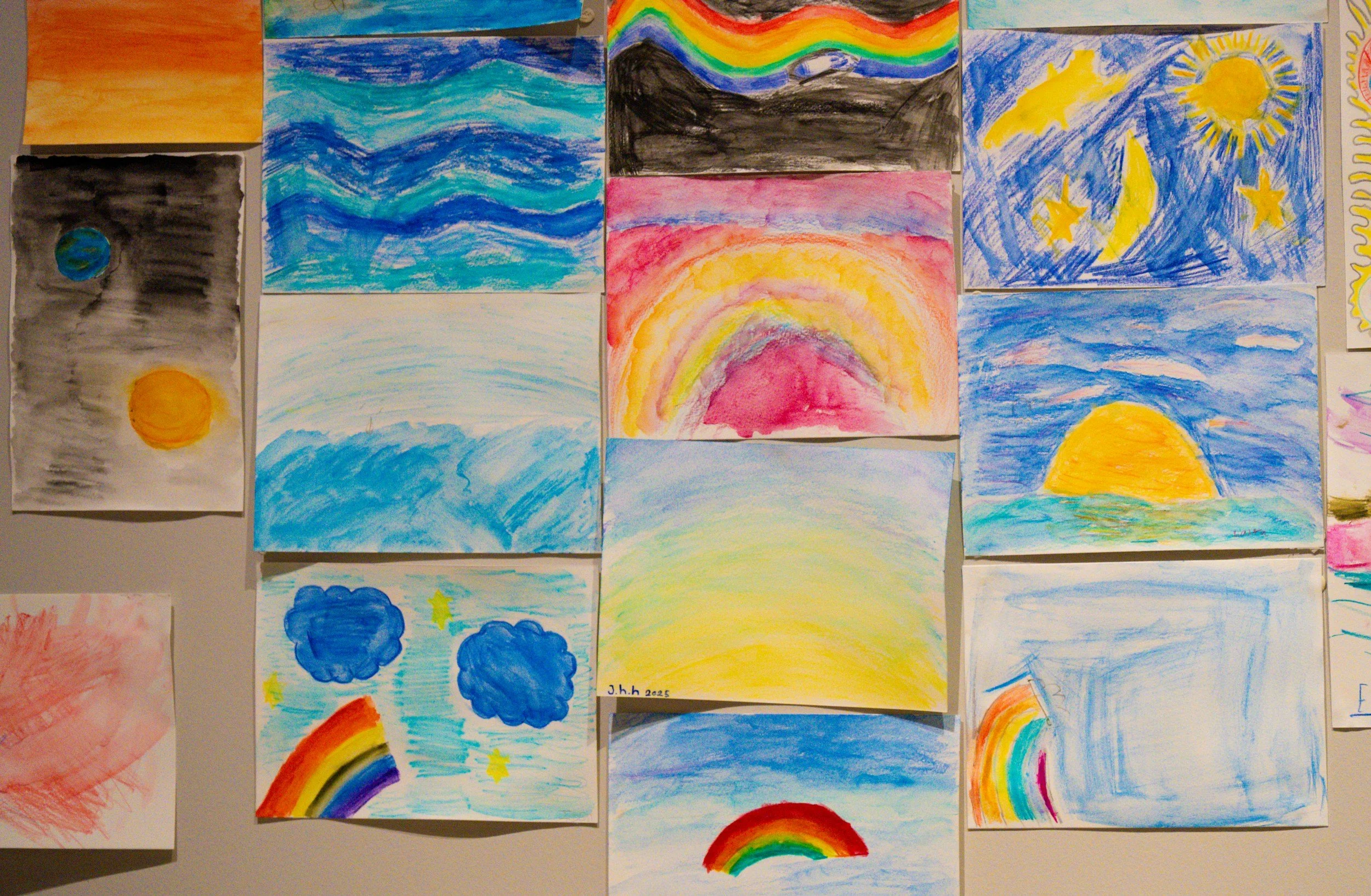 Collection of children's watercolor paintings of rainbows, sunsets, skies, stars, moons, and clouds.