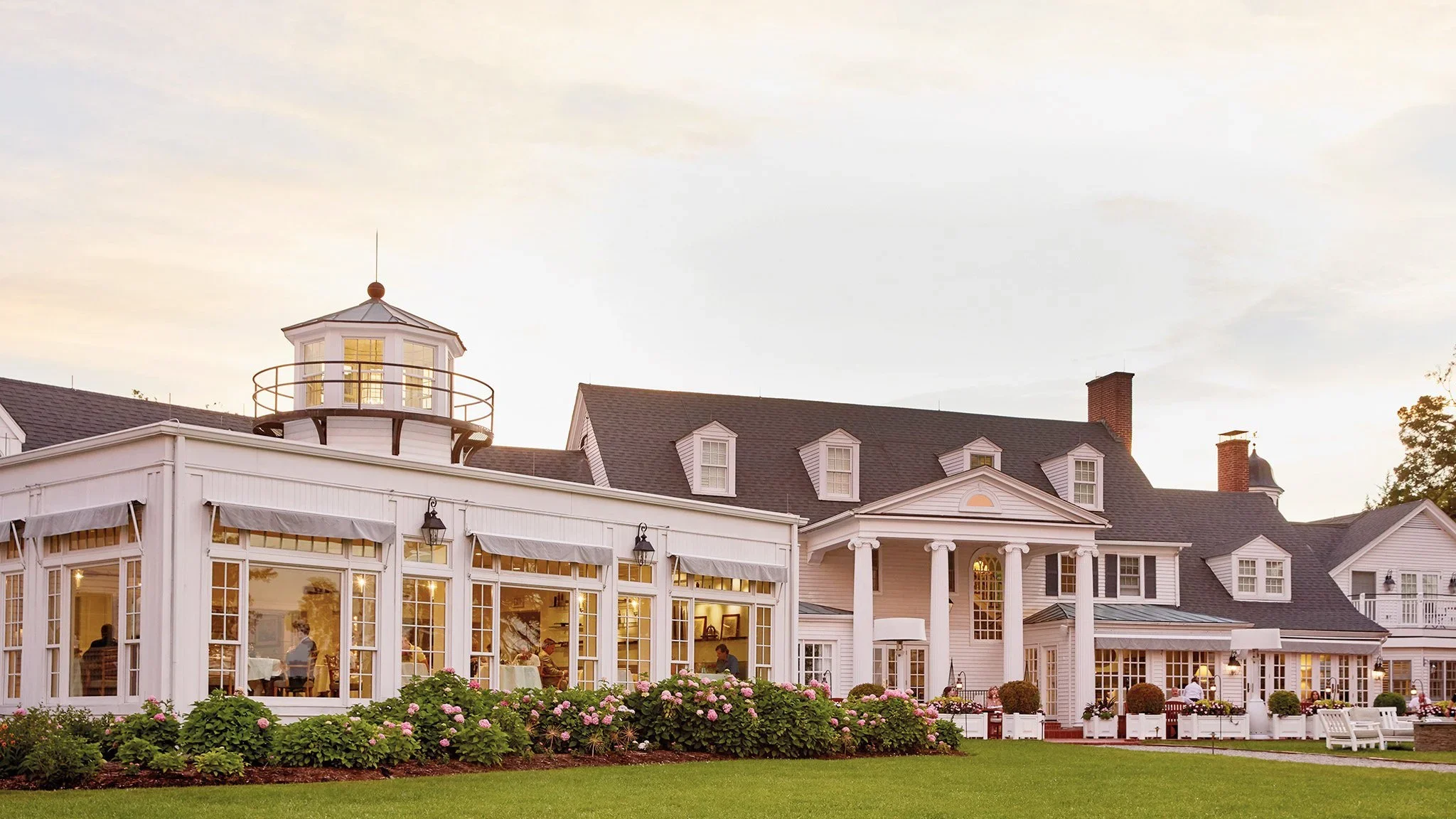 Scenic view of the water with docks extending out, and a blue dockside restaurant on the left in Kent Island, MD.