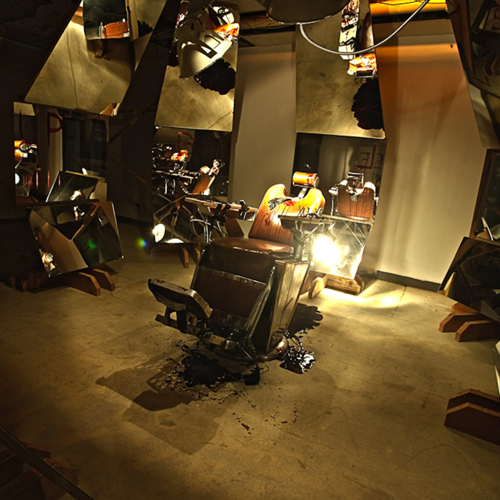 Sand spilling from a broken table, with damaged chairs and scattered debris on the floor in a dimly lit indoor setting.
