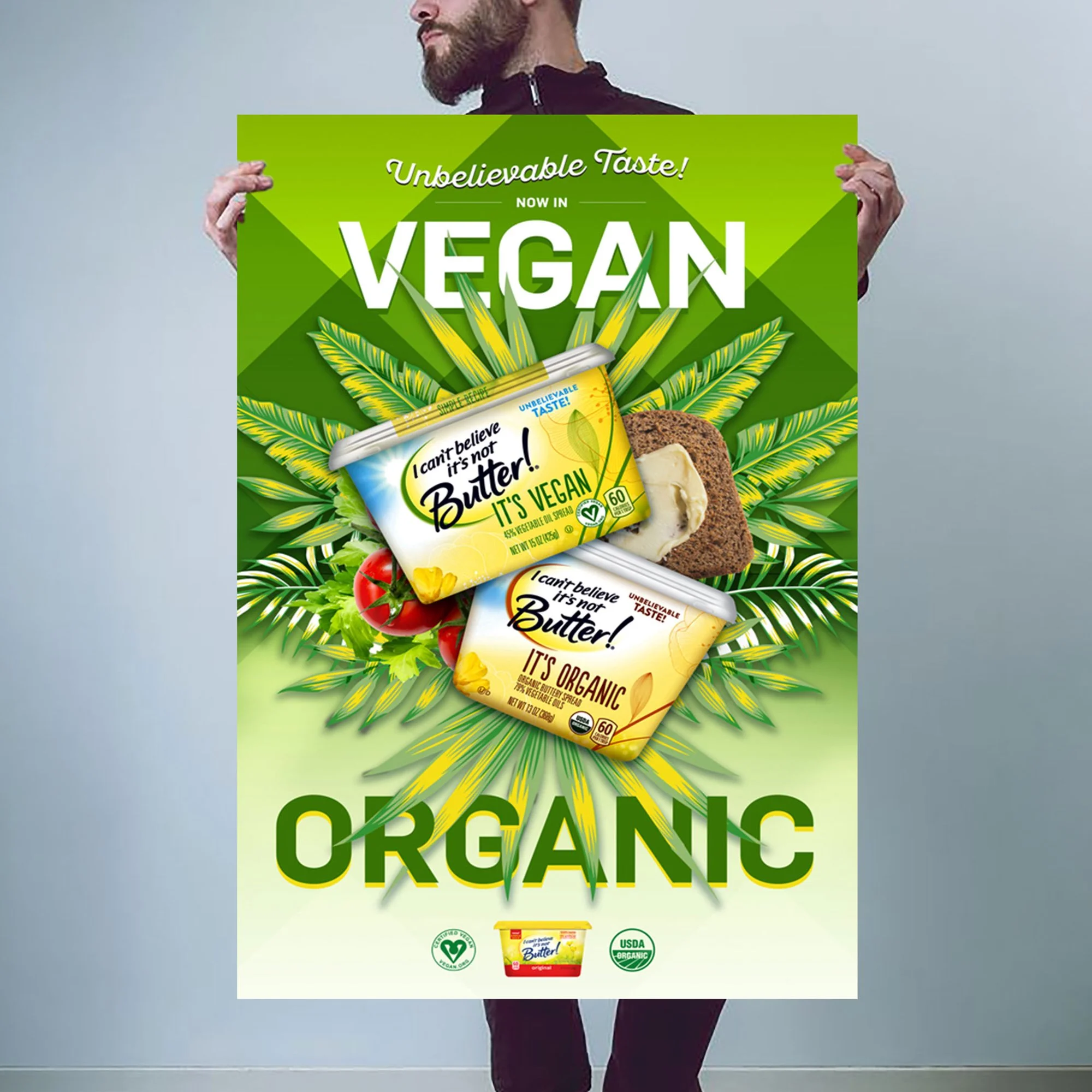 A person holding a green sign promotes vegan and organic products. The sign says "Unbelievable Taste! Now in Vegan." The background features a large leafy design, and there is a container of vegan butter at the bottom with organic and vegan certifications.