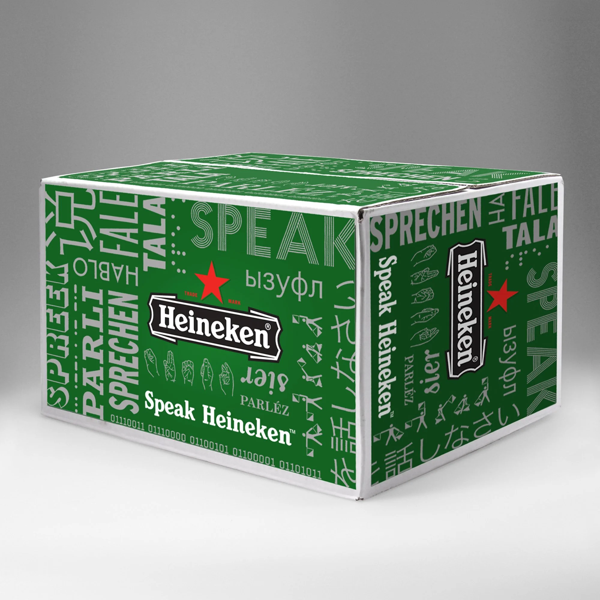 A cardboard box with a green and black design featuring the Heineken logo, text, and various symbols.