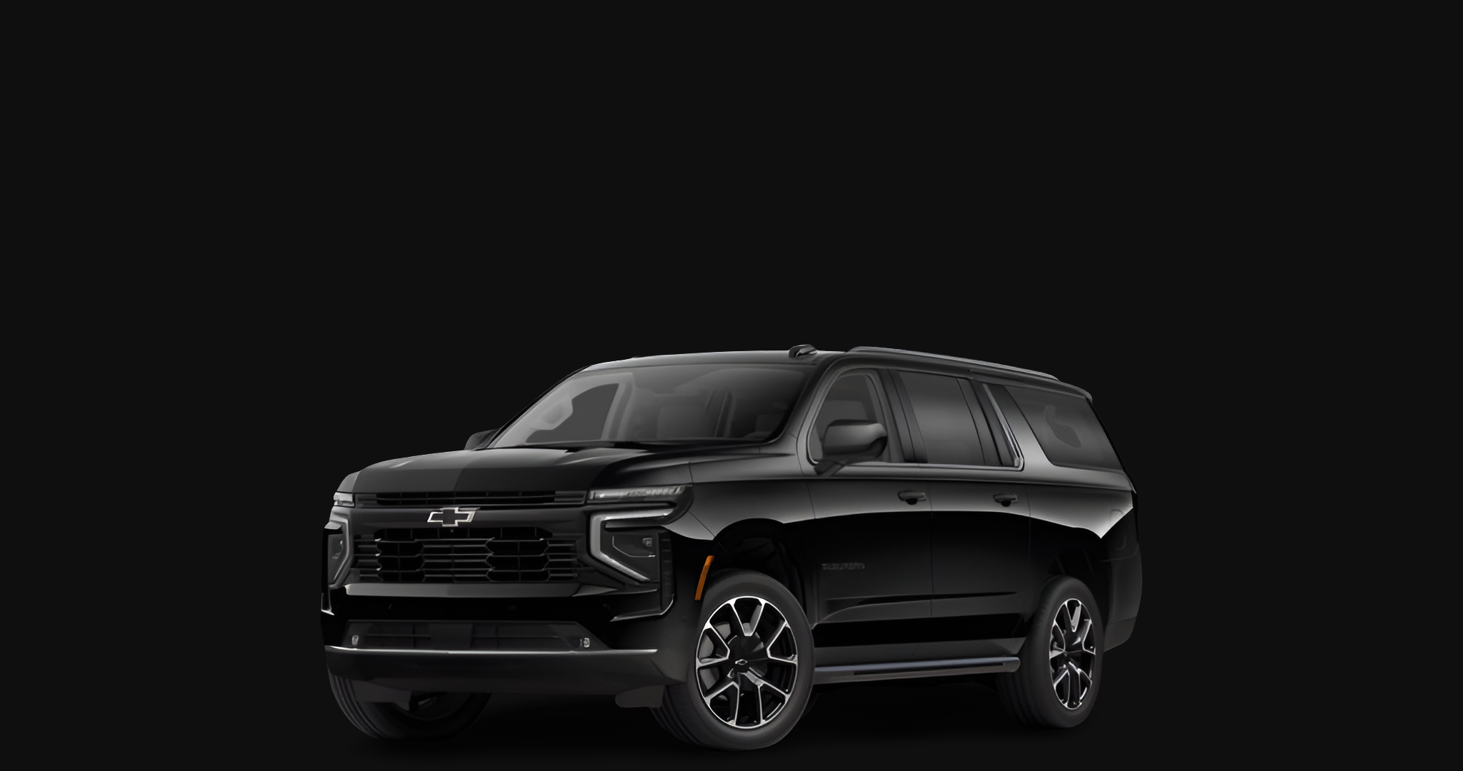 A black Chevrolet SUV against a black background.