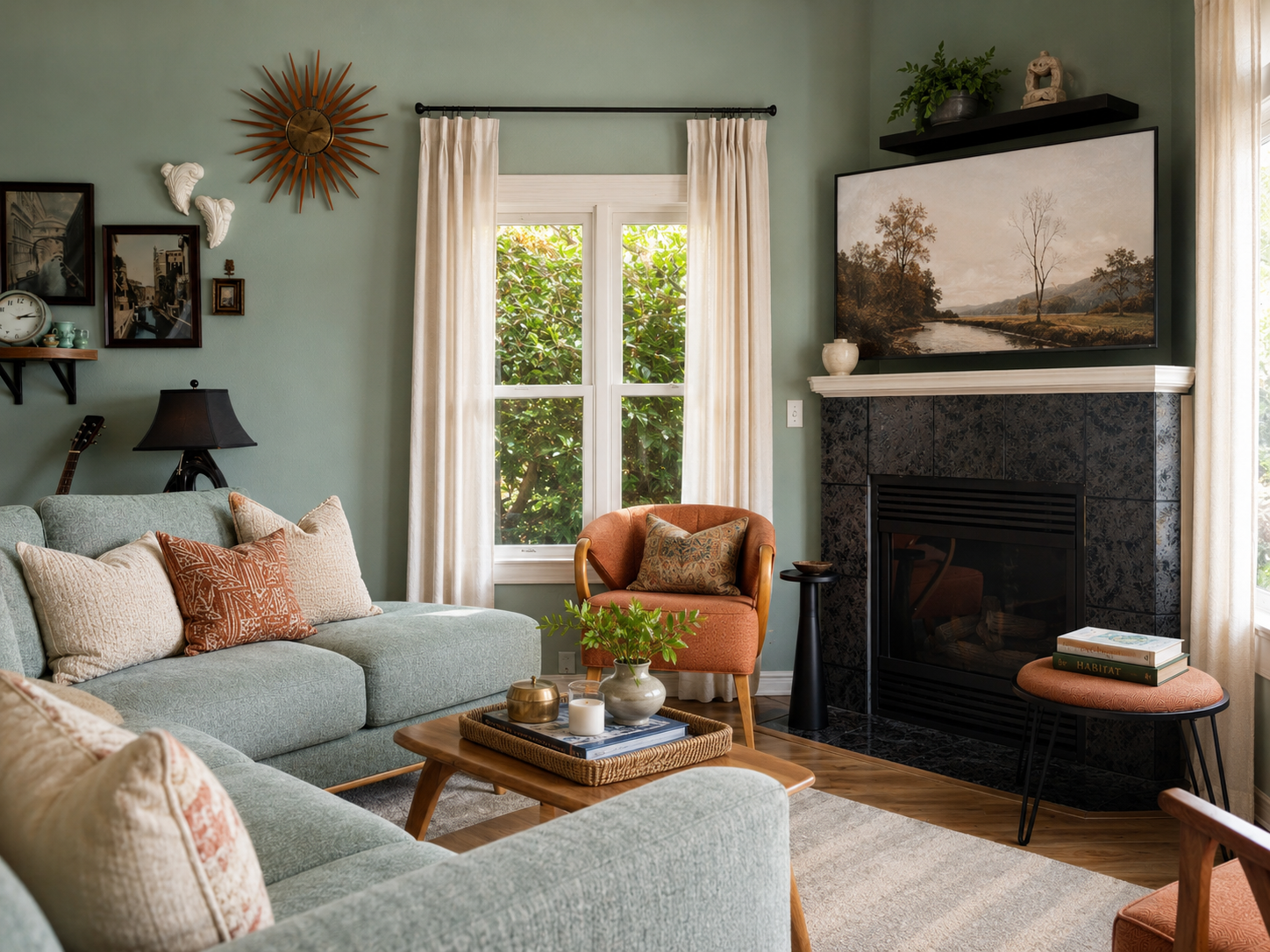 Vancouver, WA living room designed by Linda McDermott of McDermott Interiors, featuring sage green walls and sofa, a burnt orange armchair, fireplace, layered décor, and warm, inviting details.