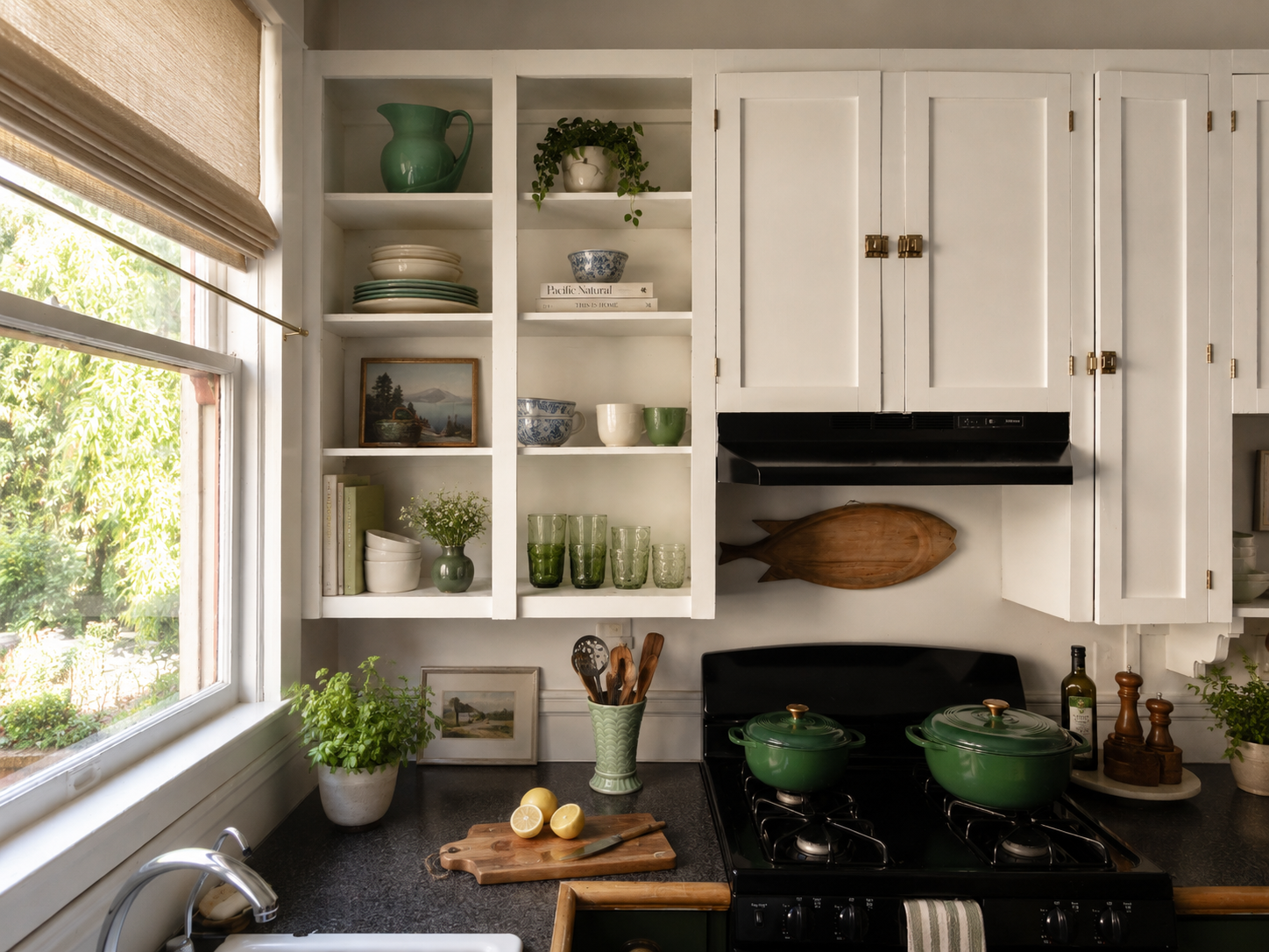 Kitchen by Linda McDermott of McDermott Interiors, Portland, OR. A bright, inviting kitchen featuring white cabinetry, open shelving, natural wood accents, curated décor, and timeless styling.