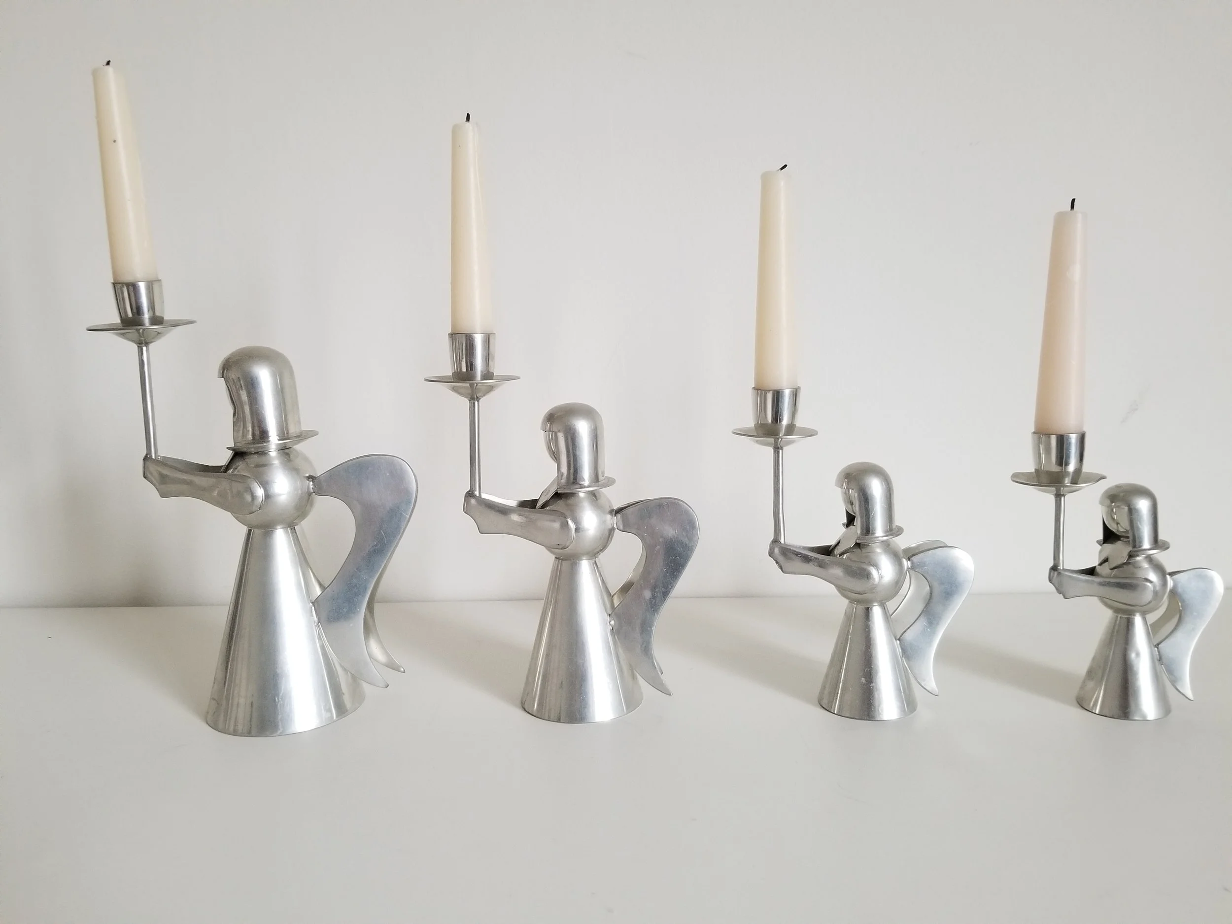 silver angels holding candles