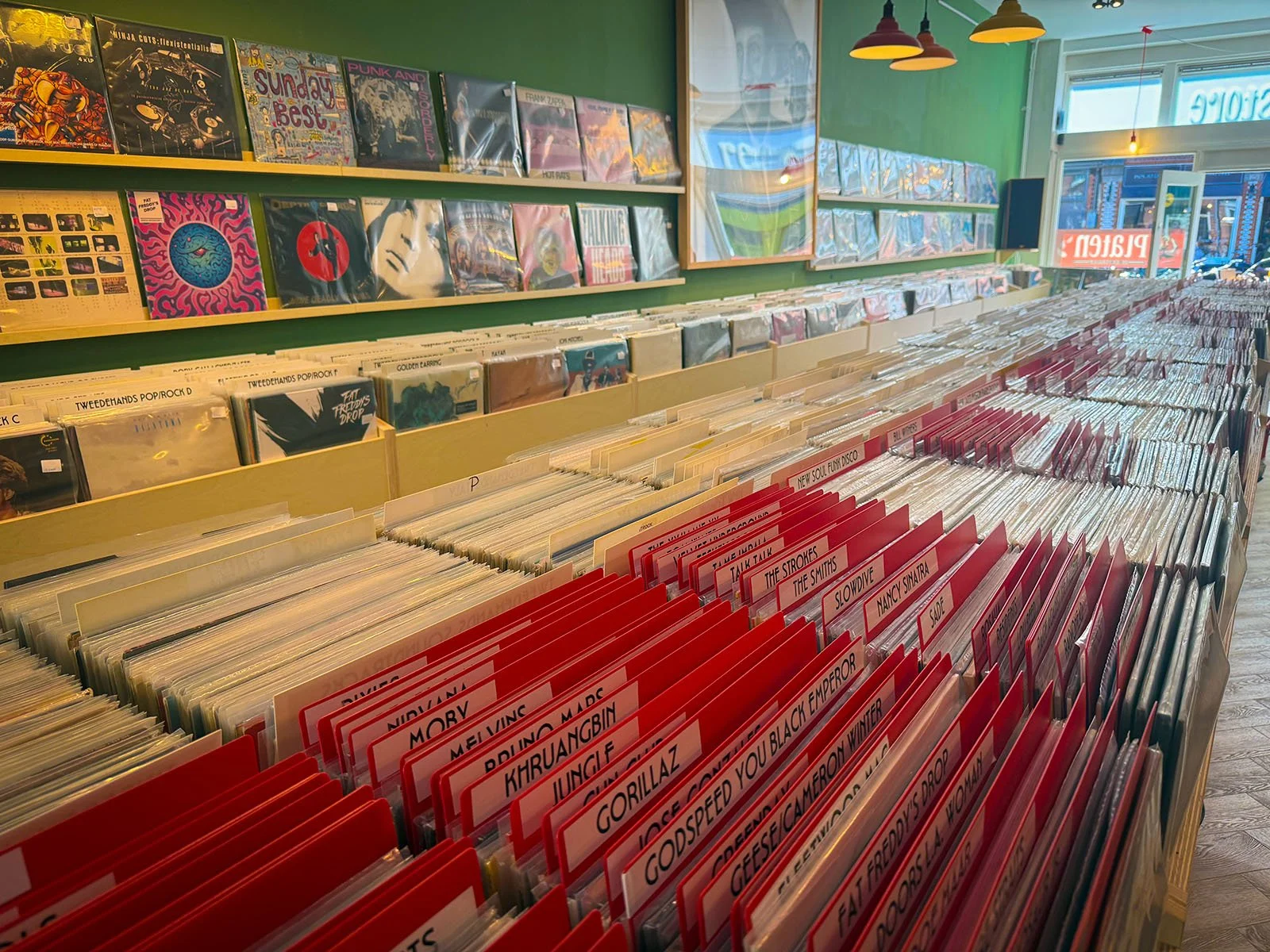 The interior of Anton Speijers Platen, a vinyl store in Amsterdam, Netherlands. There are hundreds of vinyl records on display.