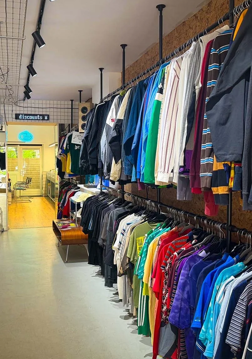 The interior of GOT.DRIP Streetwear and Records, a vinyl and clothing store in Amsterdam, Netherlands. There are hundreds of vinyl records on display.