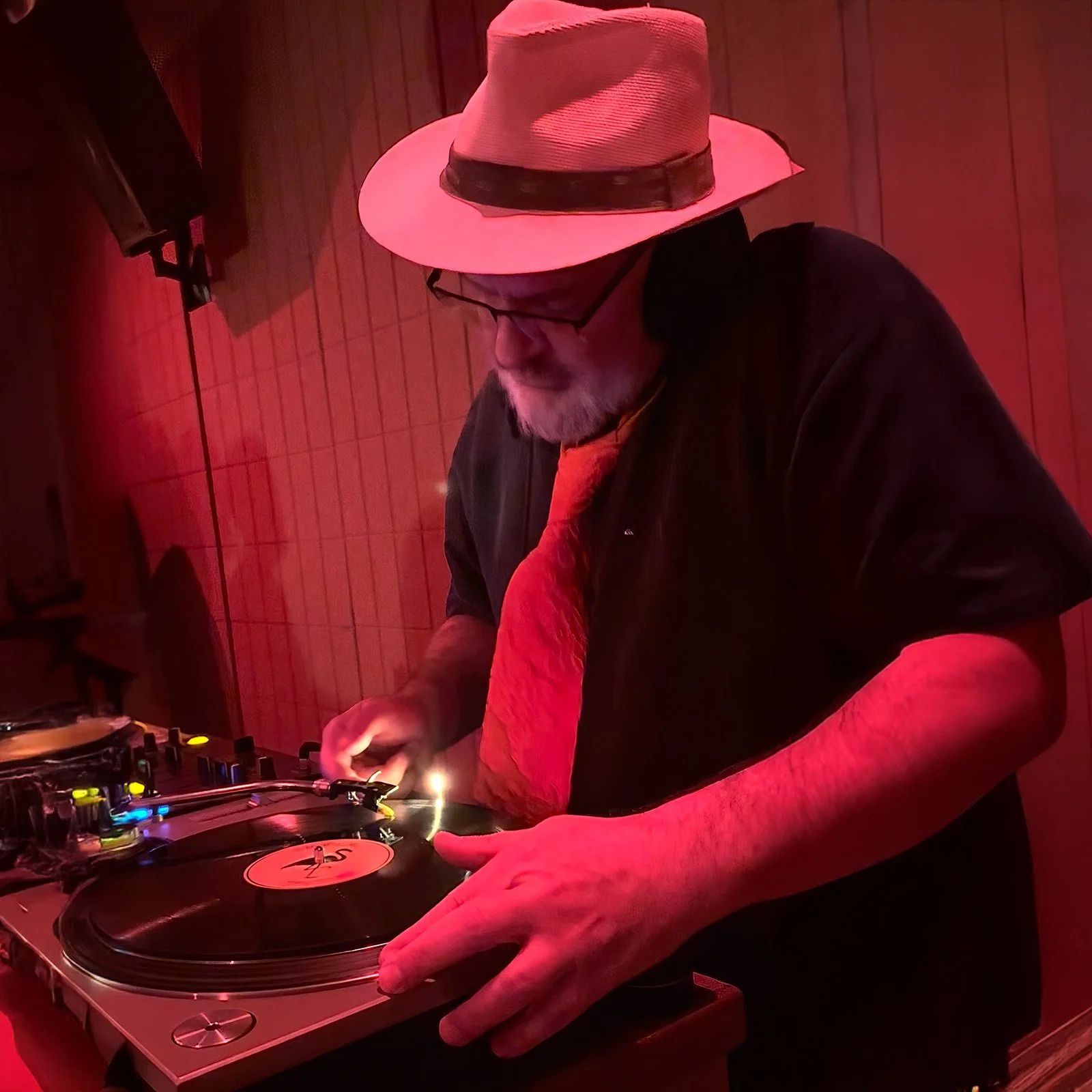 DJ Fresh Fruit at the turntables playing a guest DJ set at Amsterdam Vinyl Club, a live music community event.