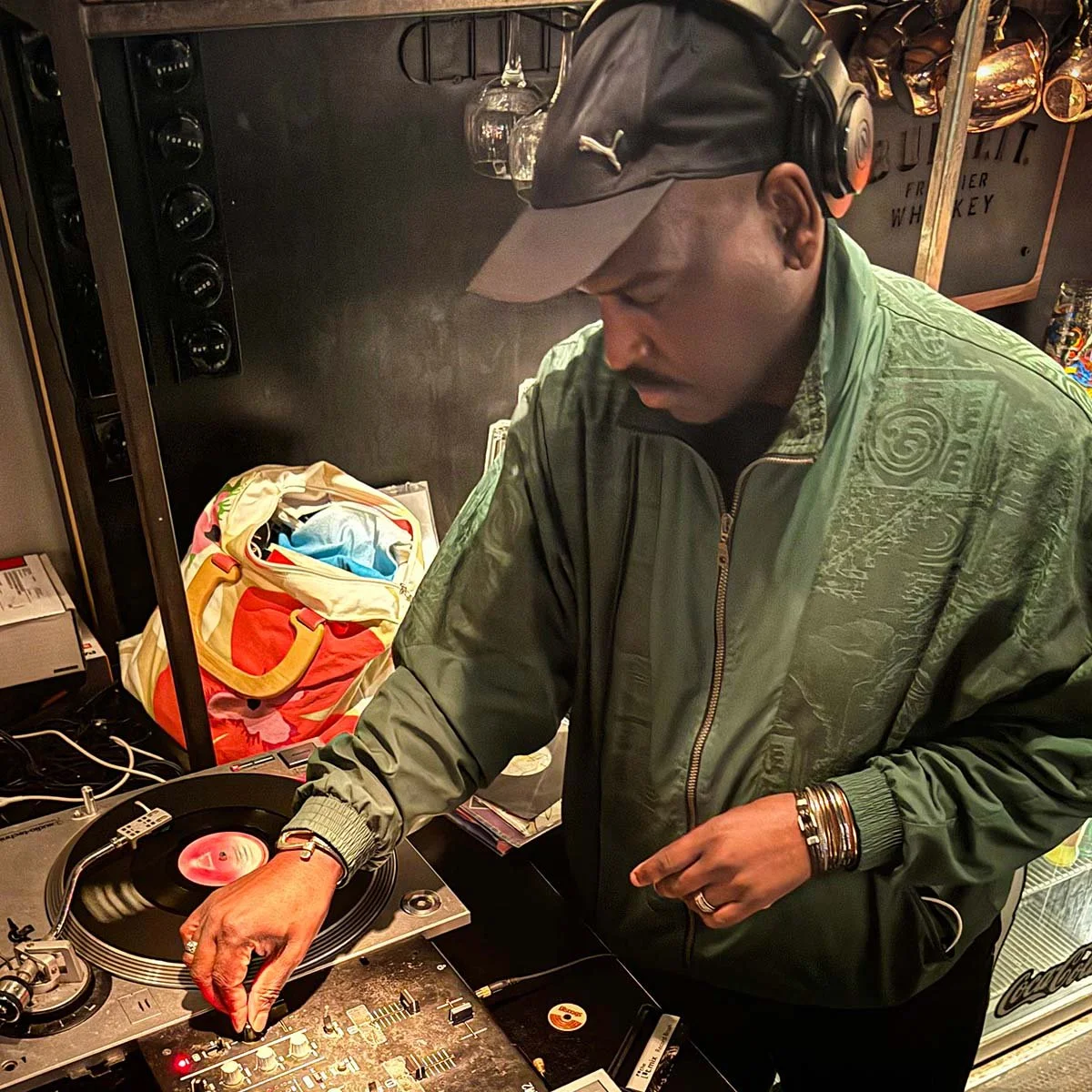 DJ Tea & 2 Sugars at the turntables playing a guest DJ set at Amsterdam Vinyl Club, a live music community event.