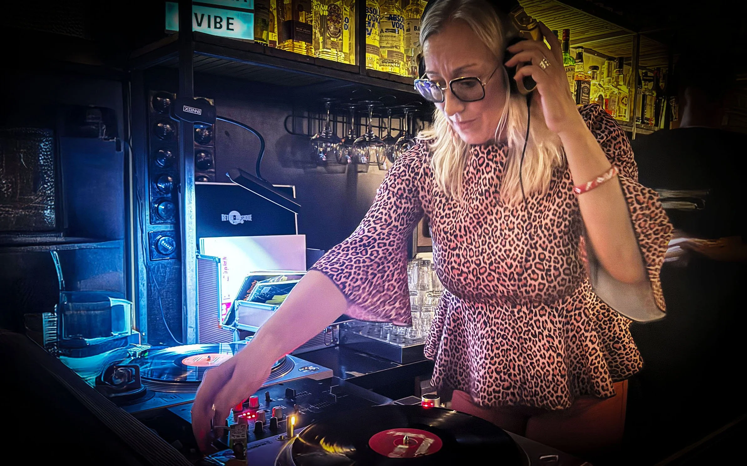 DJ Gatinha at the turntables playing a guest DJ set at Amsterdam Vinyl Club, a live music community event.