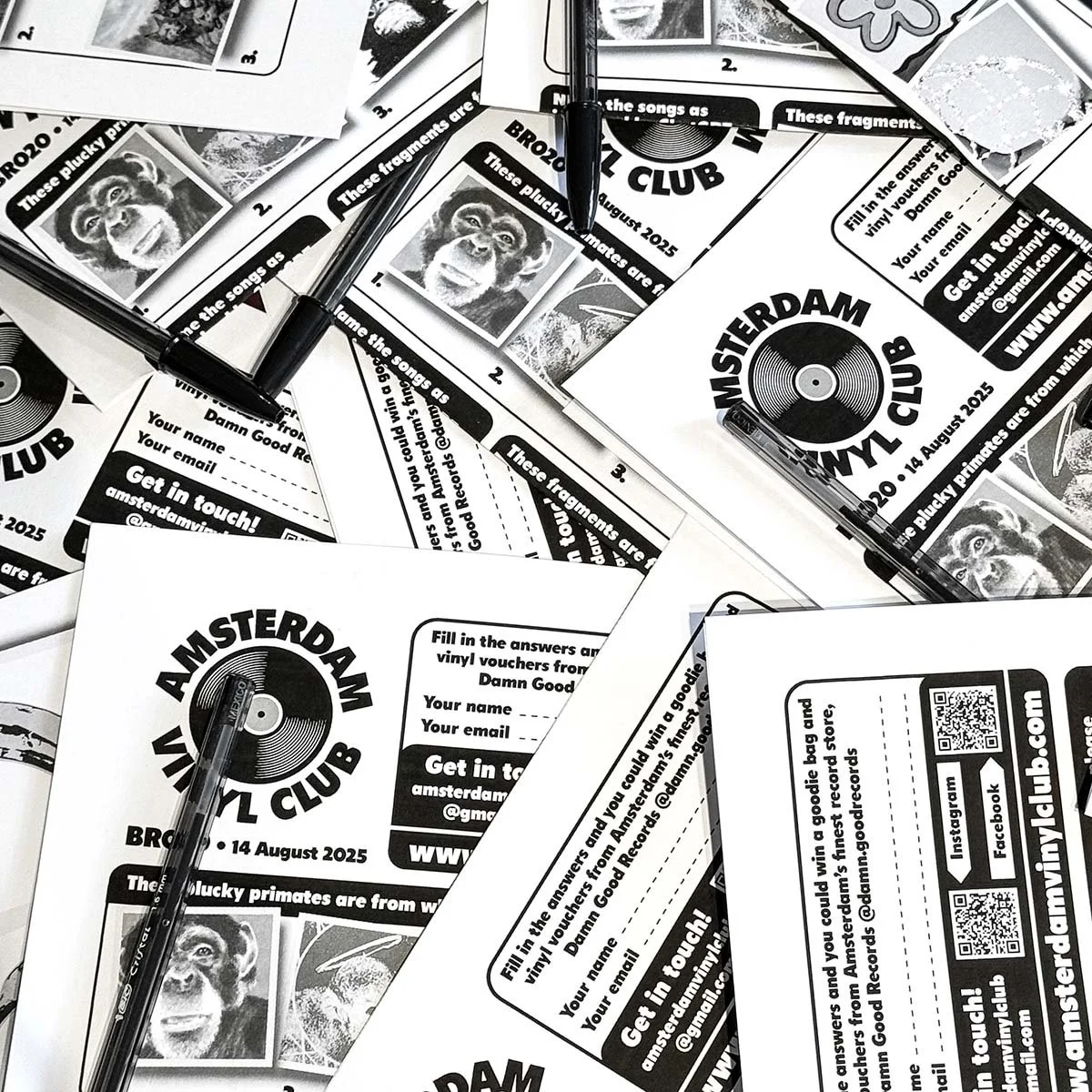 Flyers for Amsterdam Vinyl Club event with a black and white logo of a vinyl record and monkey portraits, scattered on a table with black pens, promoting an event on August 14, 2025.