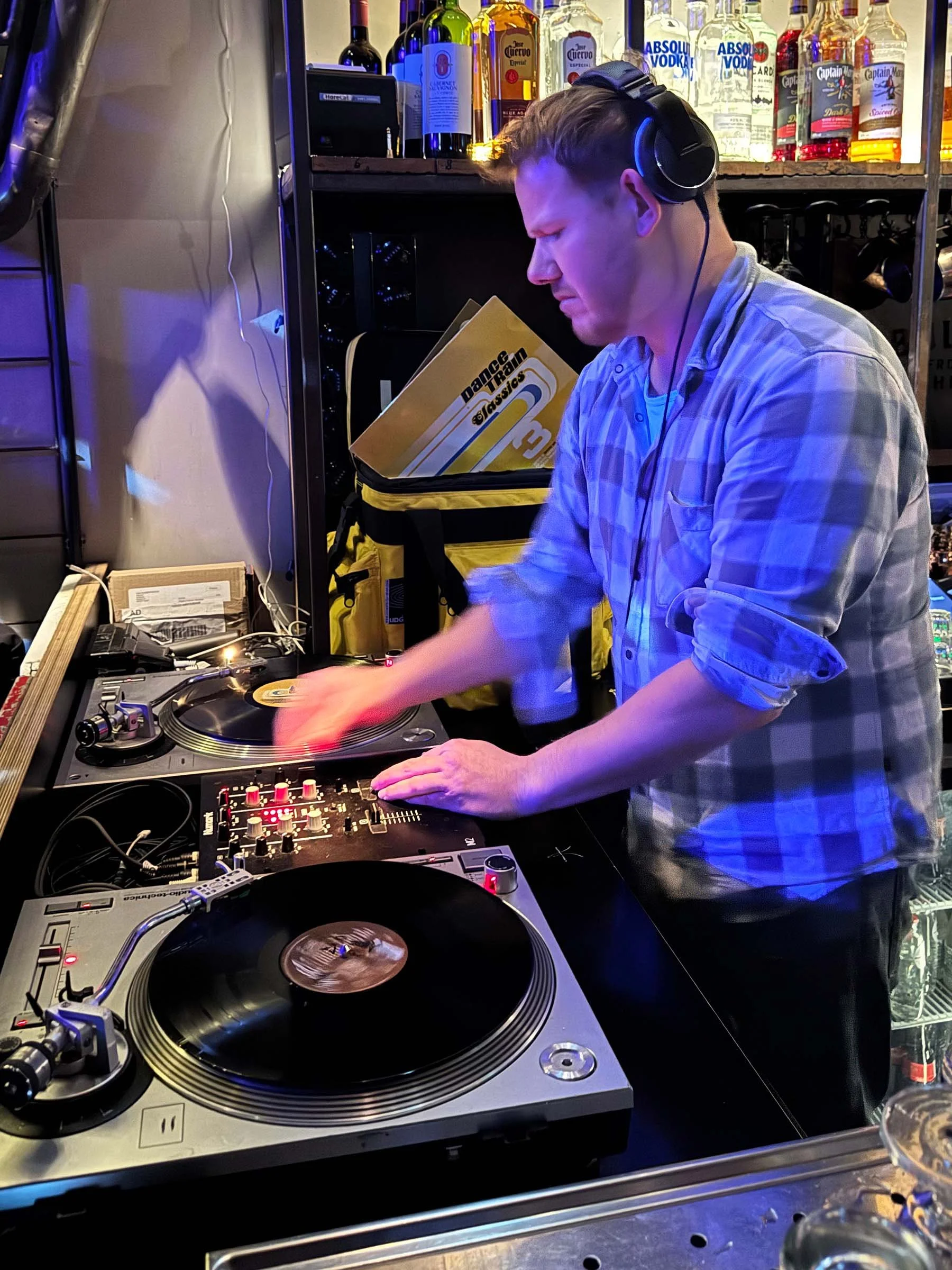 Walter Vooys at the turntables playing a guest DJ set at Amsterdam Vinyl Club, a live music community event.