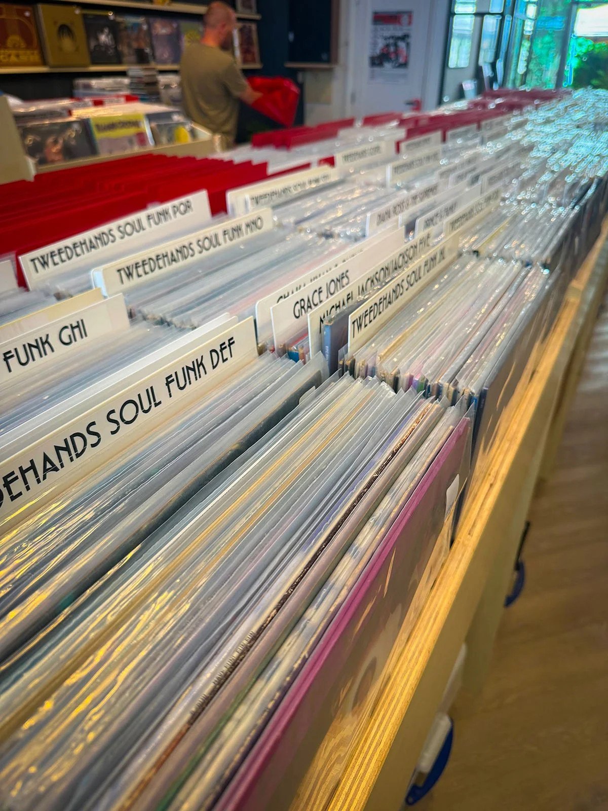 The interior of Anton Speijers Platen, a vinyl store in Amsterdam, Netherlands. There are hundreds of vinyl records on display.