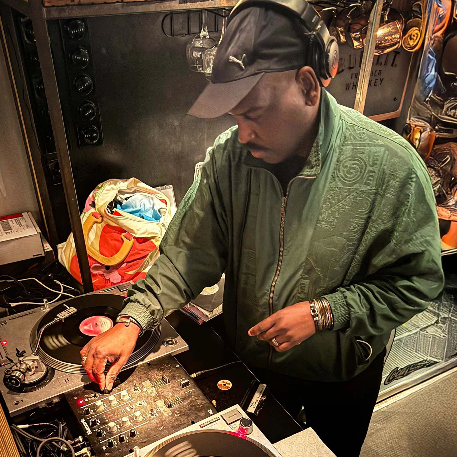 DJ Tea & 2 Sugars at the turntables playing a guest DJ set at Amsterdam Vinyl Club, a live music community event.
