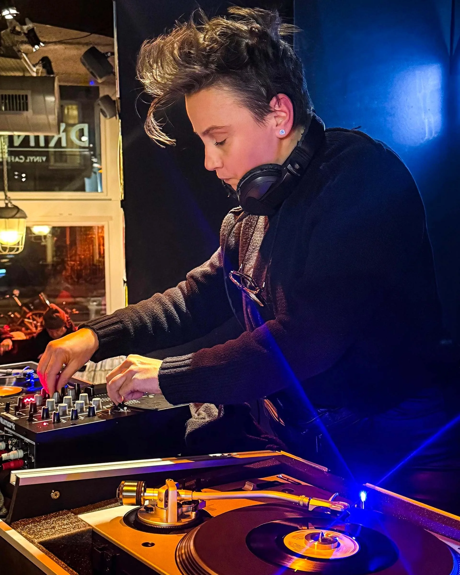 Nympho at the turntables playing a guest DJ set at Amsterdam Vinyl Club, a live music community event.
