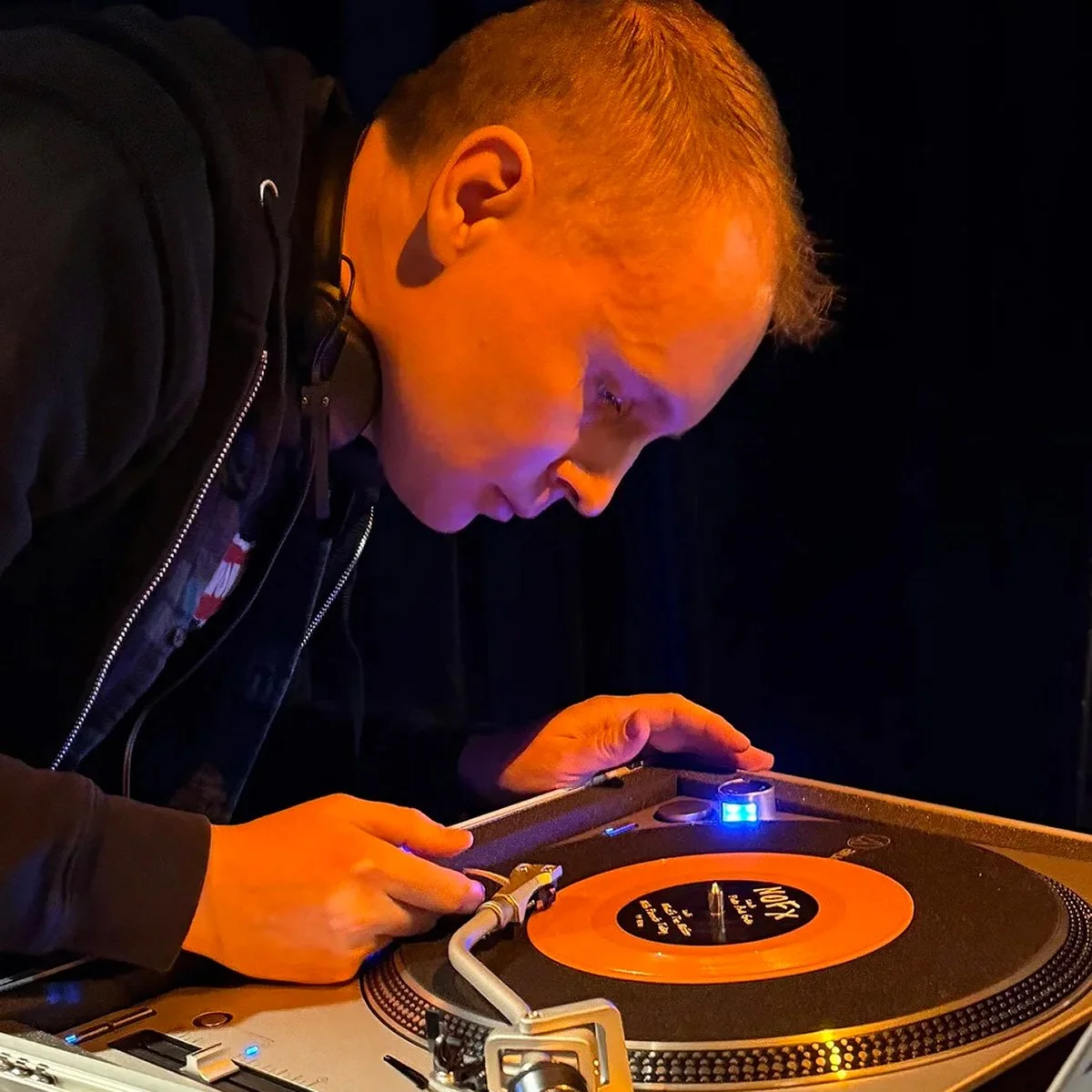 DJ Cherry Cola at the turntables playing a guest DJ set at Amsterdam Vinyl Club, a live music community event.
