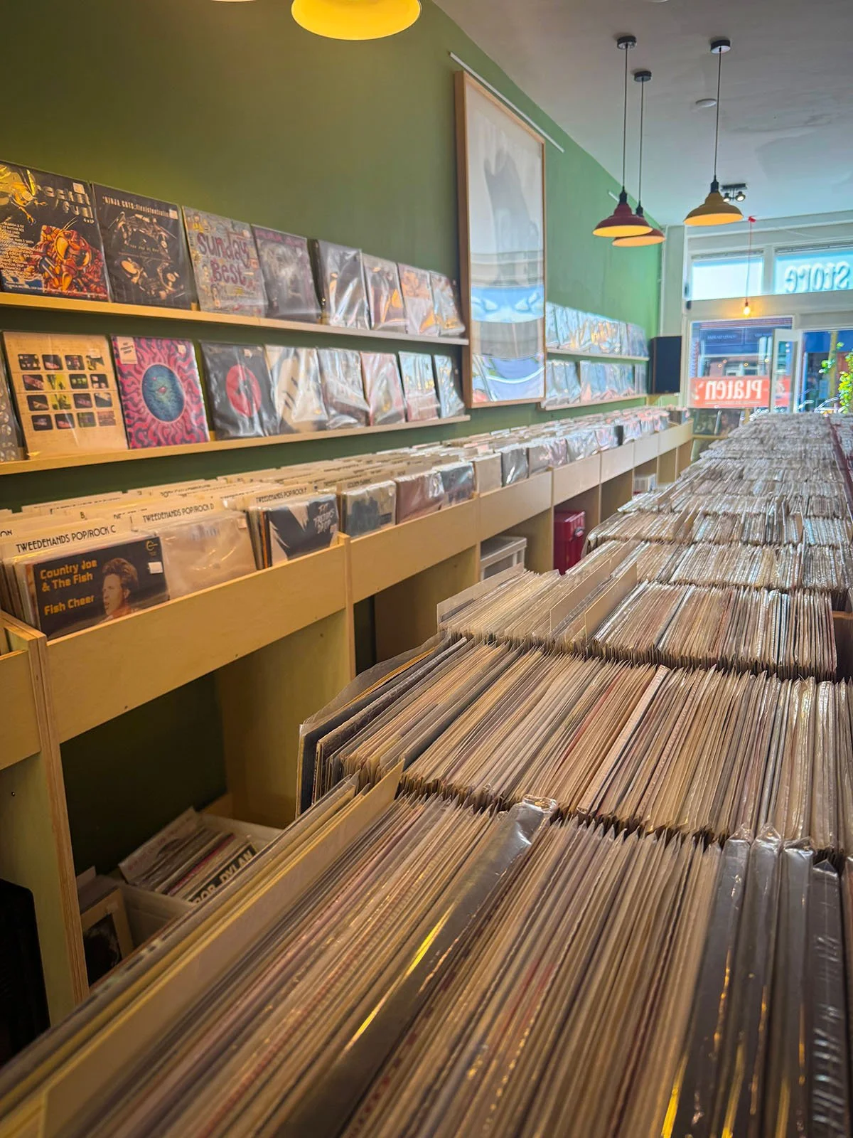 The interior of Anton Speijers Platen, a vinyl store in Amsterdam, Netherlands. There are hundreds of vinyl records on display.