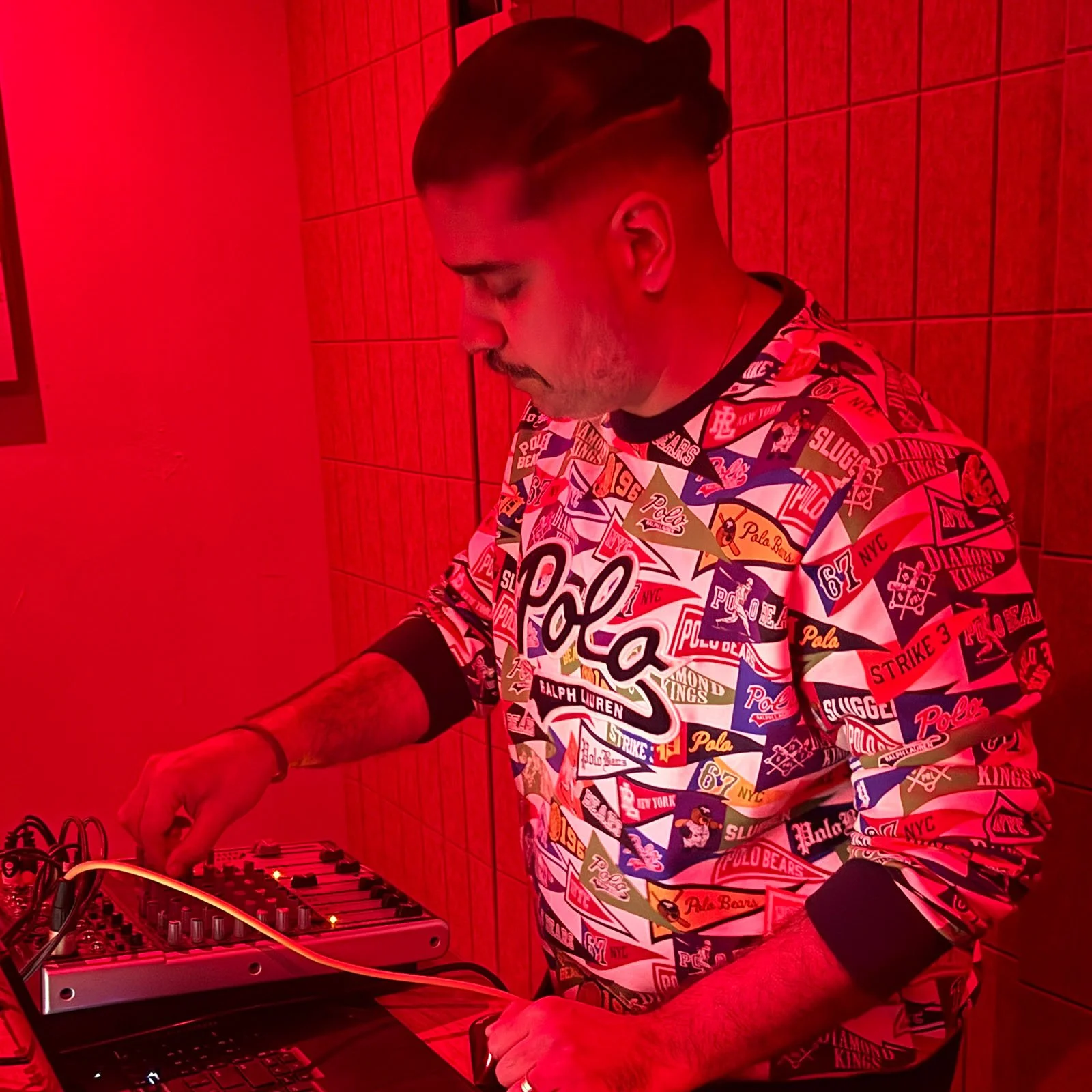 Deepak Nichani at the turntables playing a guest DJ set at Amsterdam Vinyl Club, a live music community event.