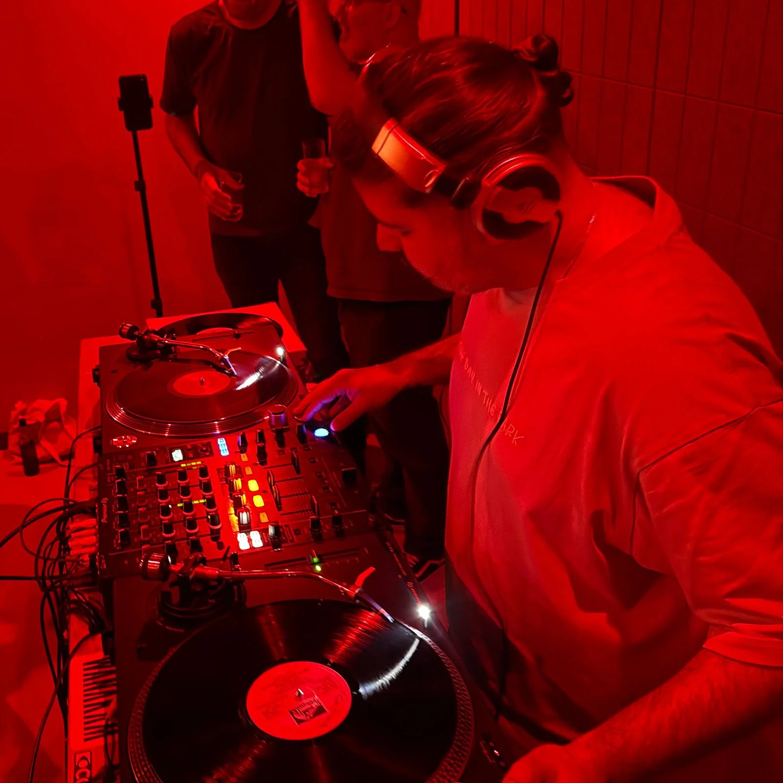 Deepak Nichani at the turntables playing a guest DJ set at Amsterdam Vinyl Club, a live music community event.